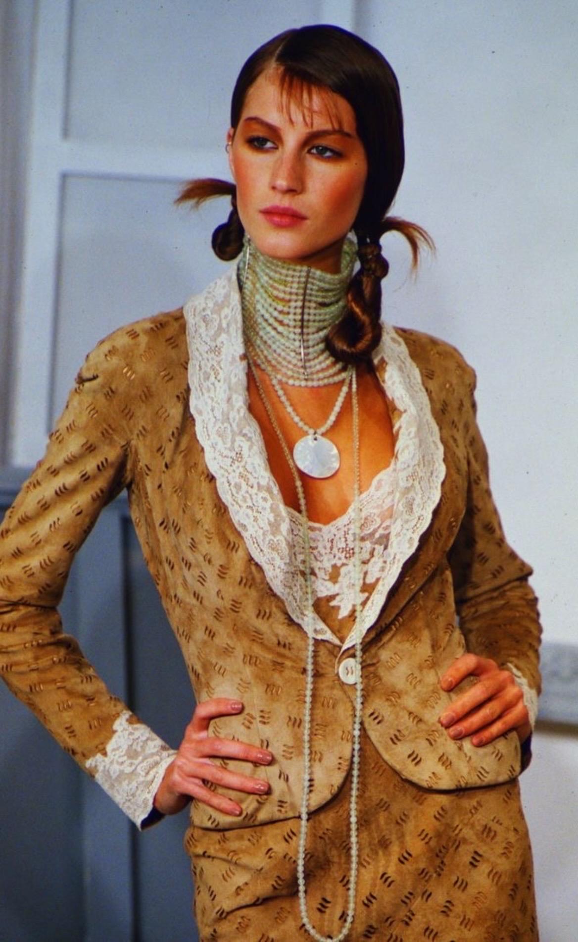 From celebrity-endorsed Queen Vin Archive (QV Archive):

A star of QV Archive, the tenderest and most spectacular choker multi strand Maasai necklace, as seen modeled by Gisele on the runway of one of the most discreet Dior shows ever, Fall 1999 RTW