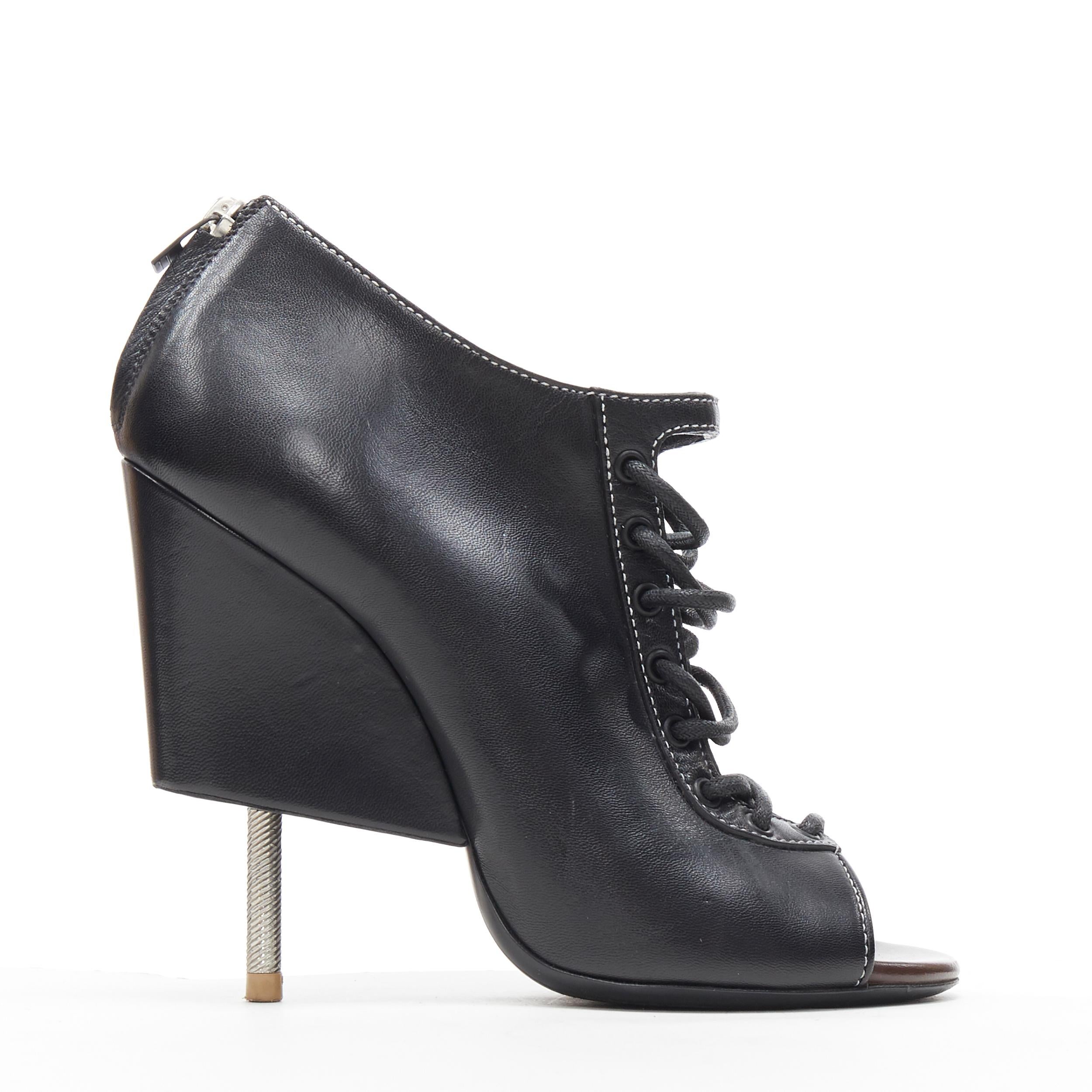 runway GIVENCHY TISCI black lace up open toe angular nail heel bootie EU38 
Brand: Givenchy
Designer: Riccardo Tisci
Model Name / Style: Bootie
Material: Leather
Color: Black
Pattern: Solid
Closure: Zip
Extra Detail: Lace front design. Zip back