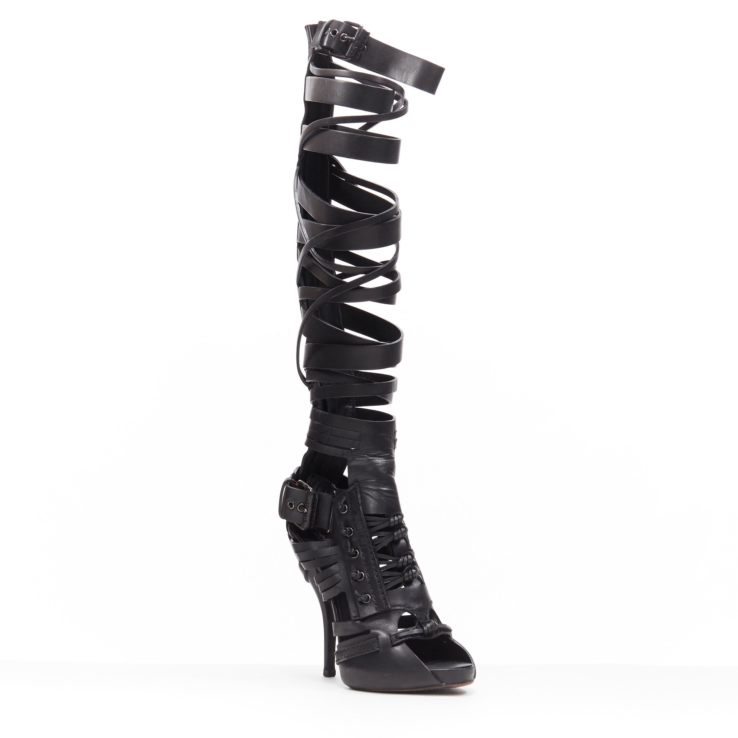 runway GIVENCHY TISCI black leather strappy peep warrior gladiator sandals EU37
Brand: Givenchy
Designer: Riccardo Tisci
Model Name / Style: Gladiator sandals
Material: Leather
Color: Black
Pattern: Solid
Closure: Zip
Extra Detail: Ultra High (4 in