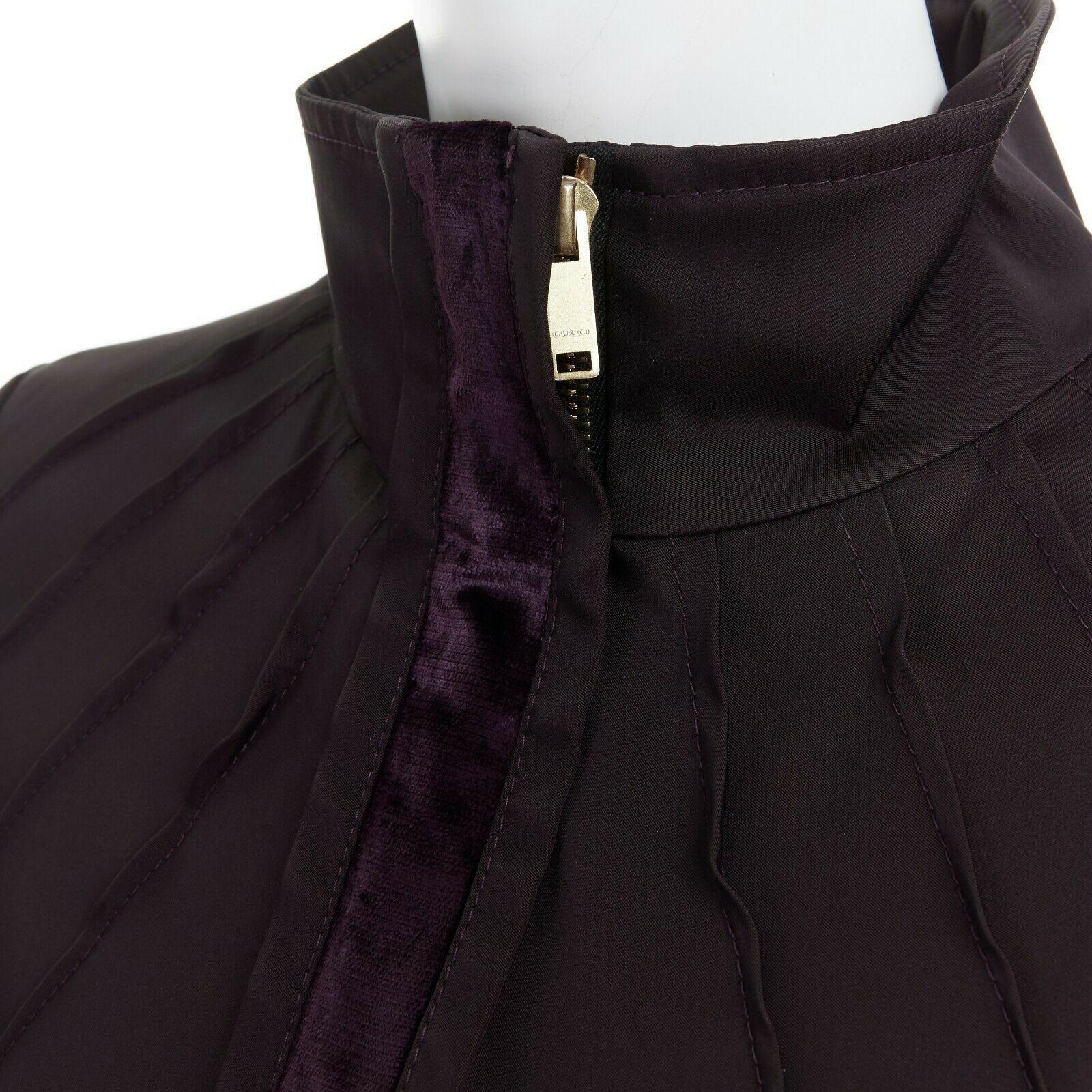 runway GUCCI TOM FORD AW04 purple velvet trimmed ruched zip jacket IT40 US4 UK8
GUCCI BY TOM FORD
FROM THE FALL WINTER 2004 RUNWAY
Acetate, nylon, polyamide, spandex, elasthane. Dark aubergine purple. 
Pleated at shoulder. Lightly padded shoulders.