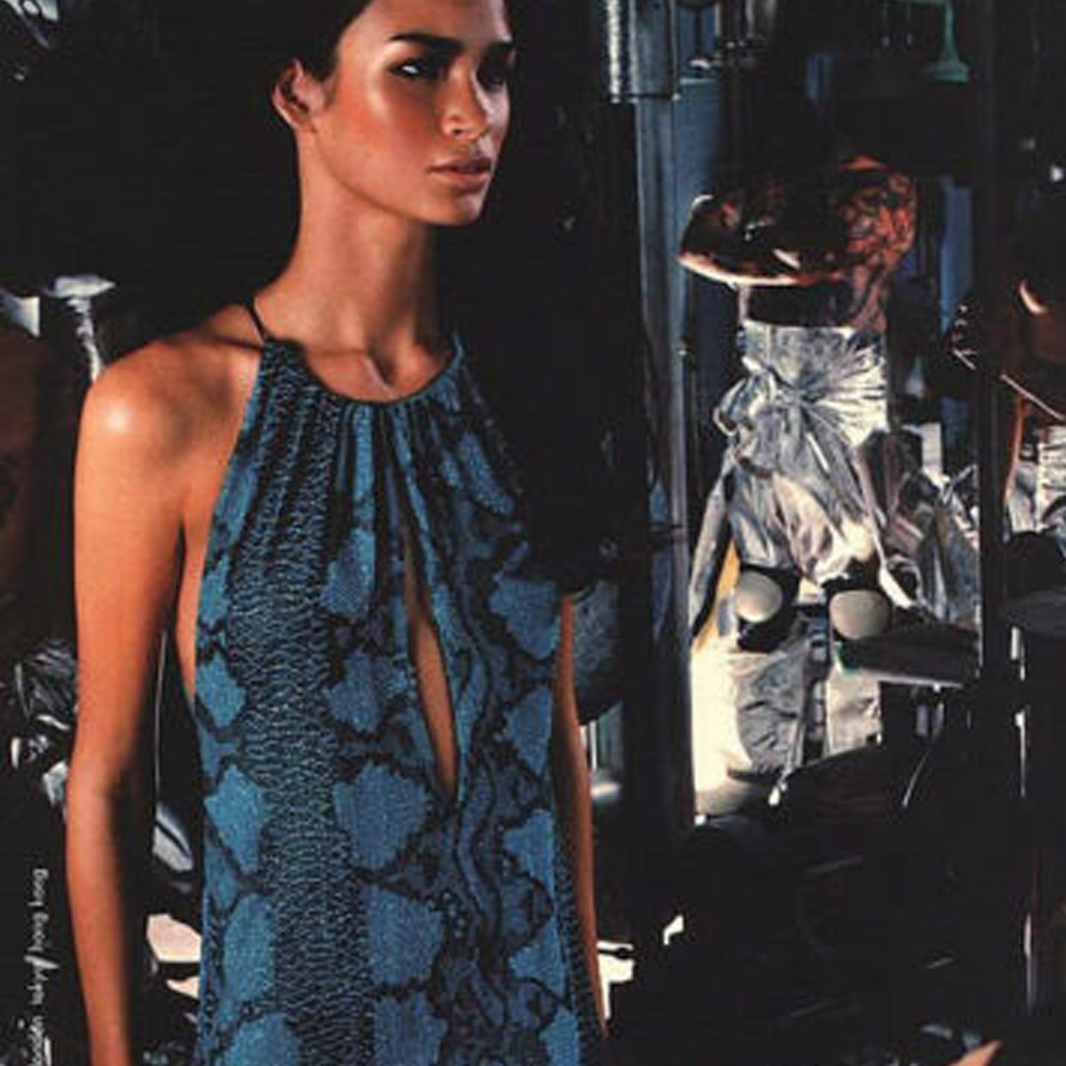 GUCCI by TOM FORD
FROM THE SPRING SUMMER 2000 RUNWAY AND CAMPAIGN
Sky blue, dark blue and black micro glass bead embroidered throughout • Python motif • Sky blue silk lining • Black leather halter neck • Clasp with gunmetal buckle signed Gucci •