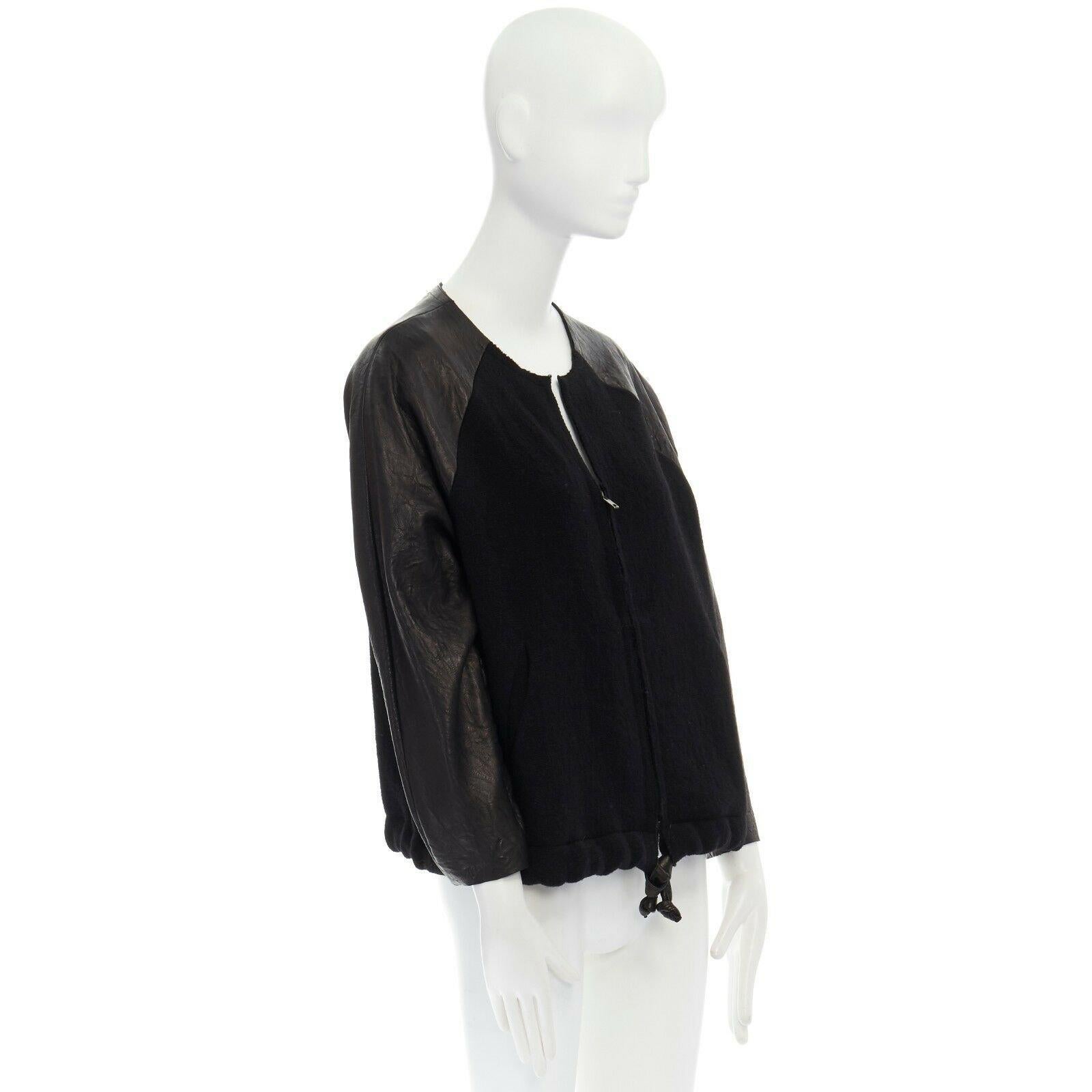 runway ISABEL MARANT Jeams leather sleeve wool zip up baseball bomber jacket S 
Reference: CC/XXXX00192 
Brand: Isabel Marant 
Designer: Isabel Marant 
Material: Wool 
Color: Black 
Pattern: Solid 
Closure: Zip 
Extra Detail: Leather, wool. Leather