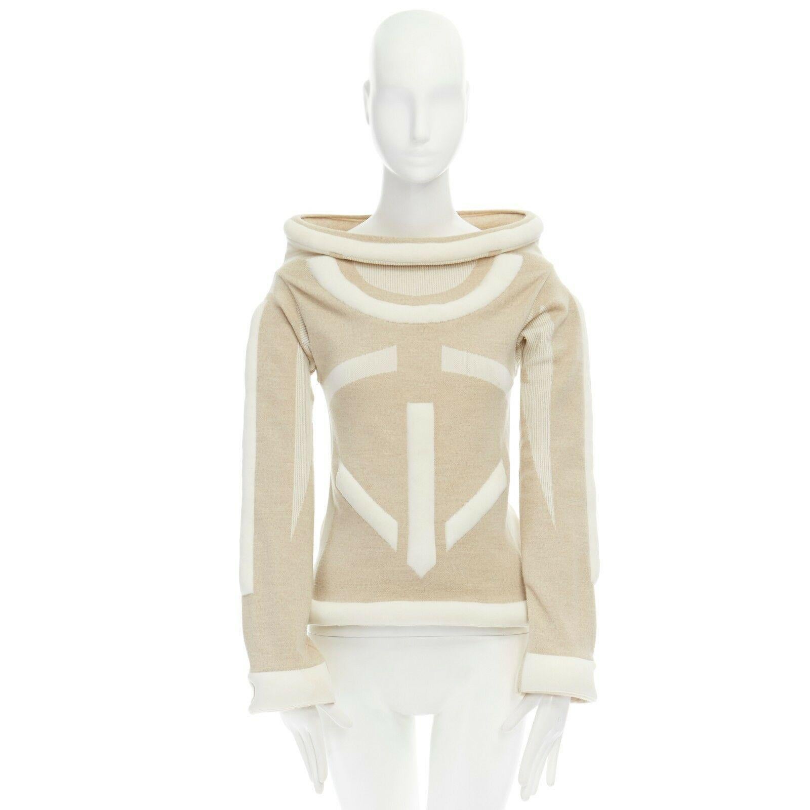 runway ISSEY MIYAKE Vintage AW1999 cream padded tubular collar bodycon top S
ISSEY MIYAKE
FROM THE FALL WINTER 1999 RUNWAY
WOOL, NYLON. BEIGE WITH CREAM HIGHLIGHTS. 
PADDED TUBULAR STRUCTURED ON COLLAR AND HEM. WIDE STAND COLLAR. 
PADDED SHAPED