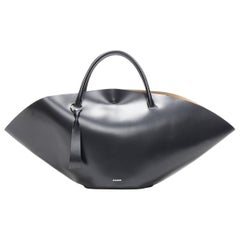 runway JIL SANDER Sombrero Large black smooth leather top handle flared tote bag