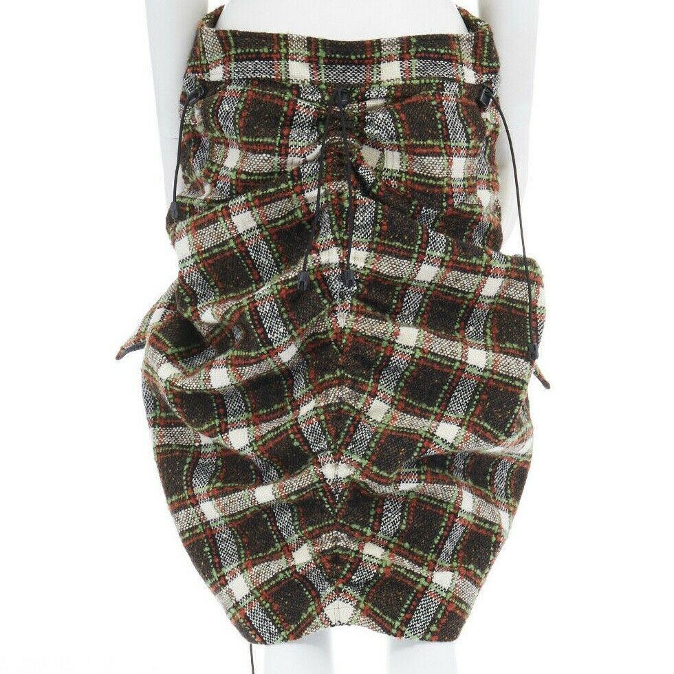 runway JUNYA WATANABE AW2005 checked tweed Windstopper lined parachute skirt M

JUNYA WATANABE by COMME DES GARCONS
FROM THE AD2005 COLLECTION
Nylon, wool, mohair . Brown green checkered wool tweed fabric . 
Lined and bonded in dark grey WindStopper