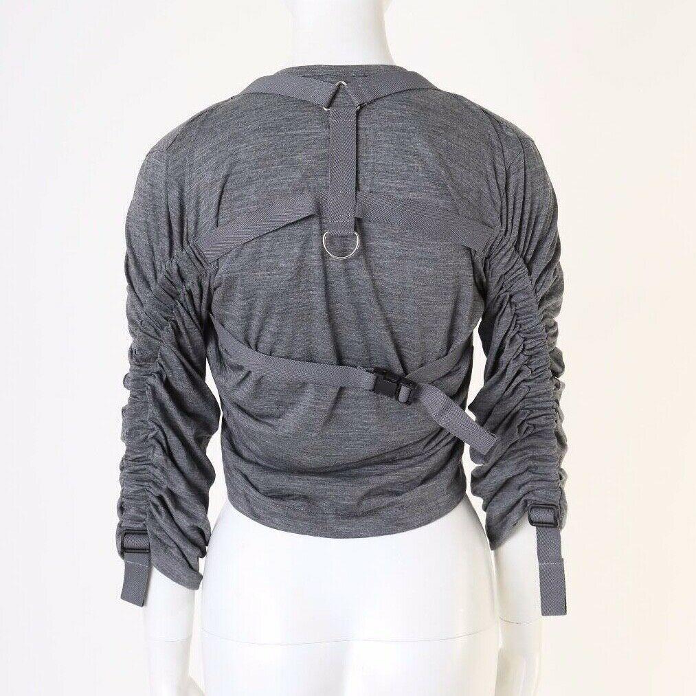 runway JUNYA WATANABE SS03 Parachute grey bondage harness buckle top S
JUNYA WATANABE
FROM THE SPRING SUMMER 2002 COLLECTION
WOOL. GREY. CONTRAST BROWN RIBBON STRAPS THROUGHOUT. 
PARACHUTE SAFETY HARNESS DESIGN. HARNESS INTEGRATED INTO THE PANTS TO