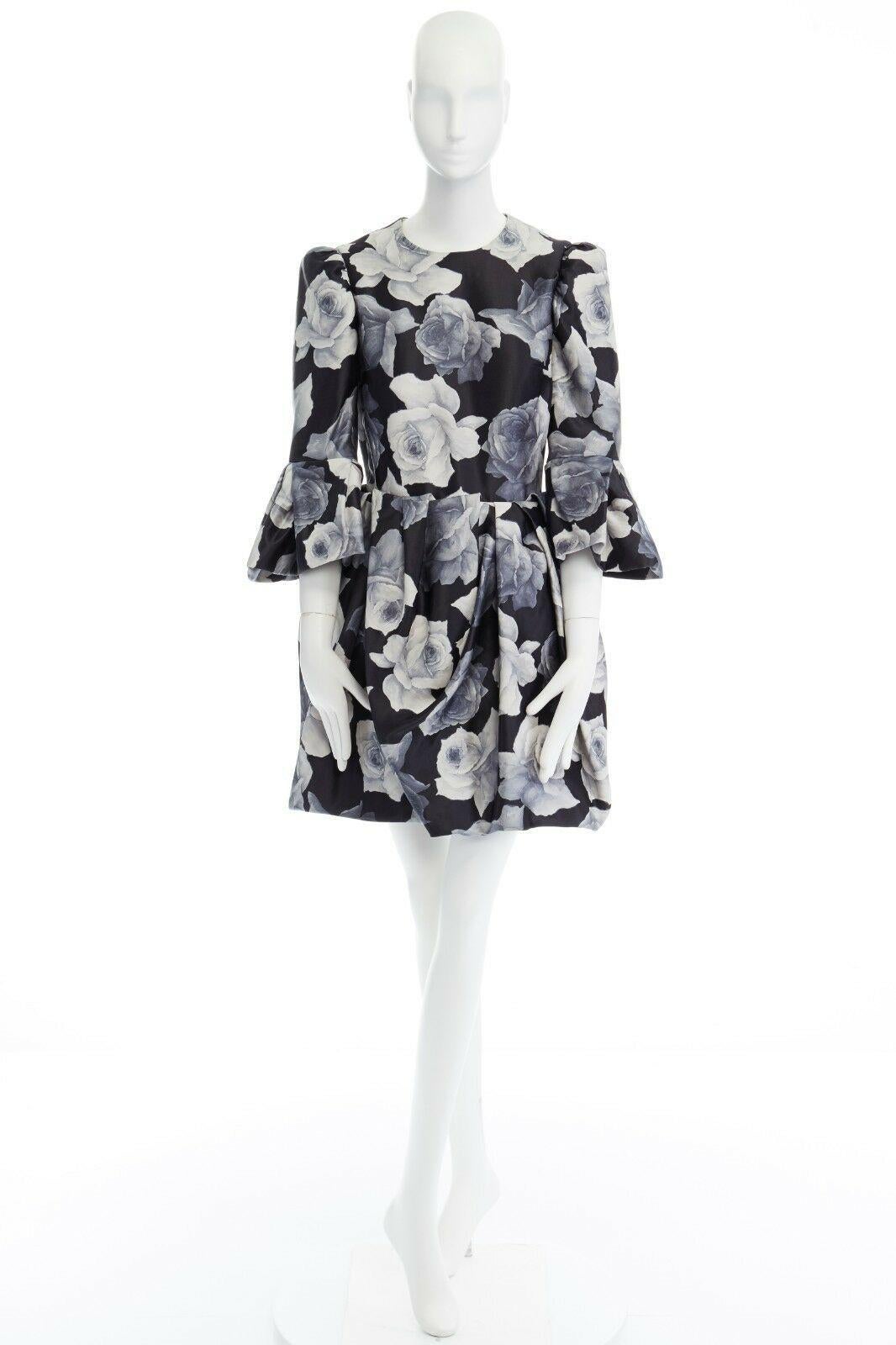 runway LANVIN AW11 black rose print puff shoulder ruffle cuff cocktail dress XS

LANVIN BY ALBER ELBAZ
FROM THE FALL WINTER 2011 COLLECTION
Cotton, silk. Black base with floral rose print in grey, Round neck. 
Puff padded shoulder. 3/4 sleeves.