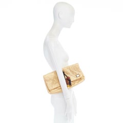 runway LOUIS VUITTON SS09 Masai GM African Queen gold monogram tribal clutch bag