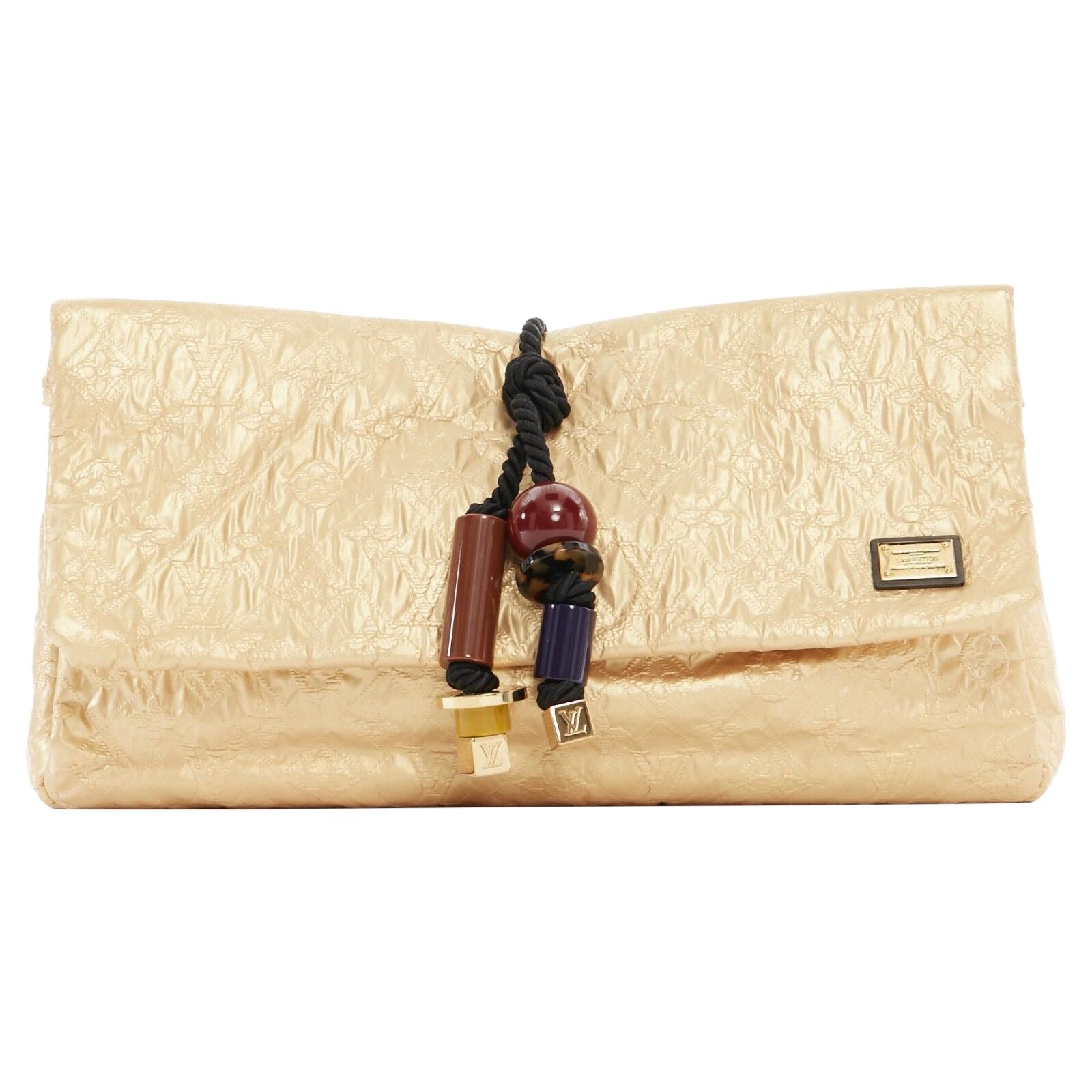 runway LOUIS VUITTON SS09 Masai GM African Queen gold monogram tribal clutch bag