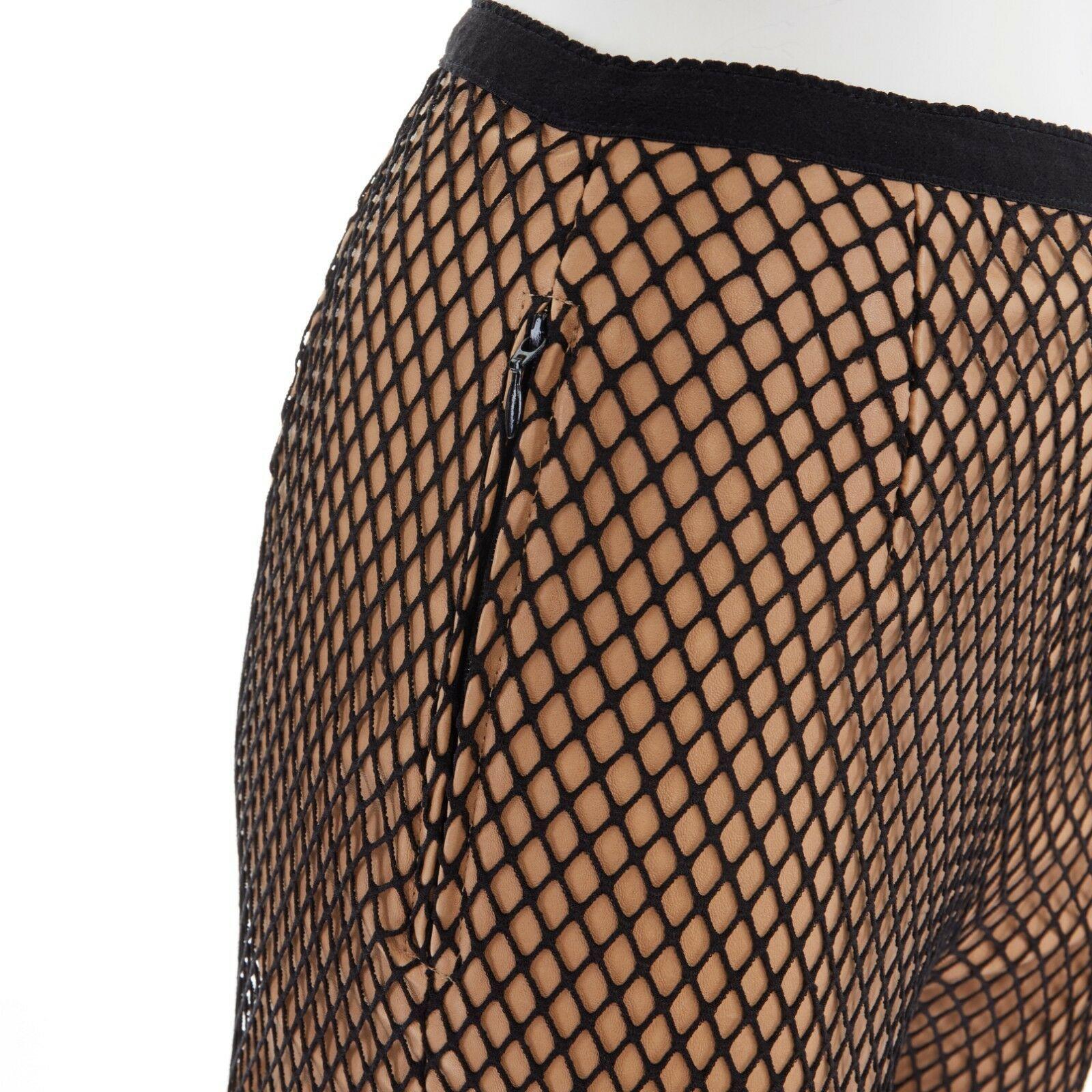 runway MAISON MARGIELA AW11 Tromp Loeil nude leather black fishnet legging pants
MAISON MARTIN MARGIELA
FROM THE FALL 2011 COLLECTION
Tromp Loeil collection. Nude leather leggings. Black fishnet overlay. 
Elasticated ribbed waistband. Concealed