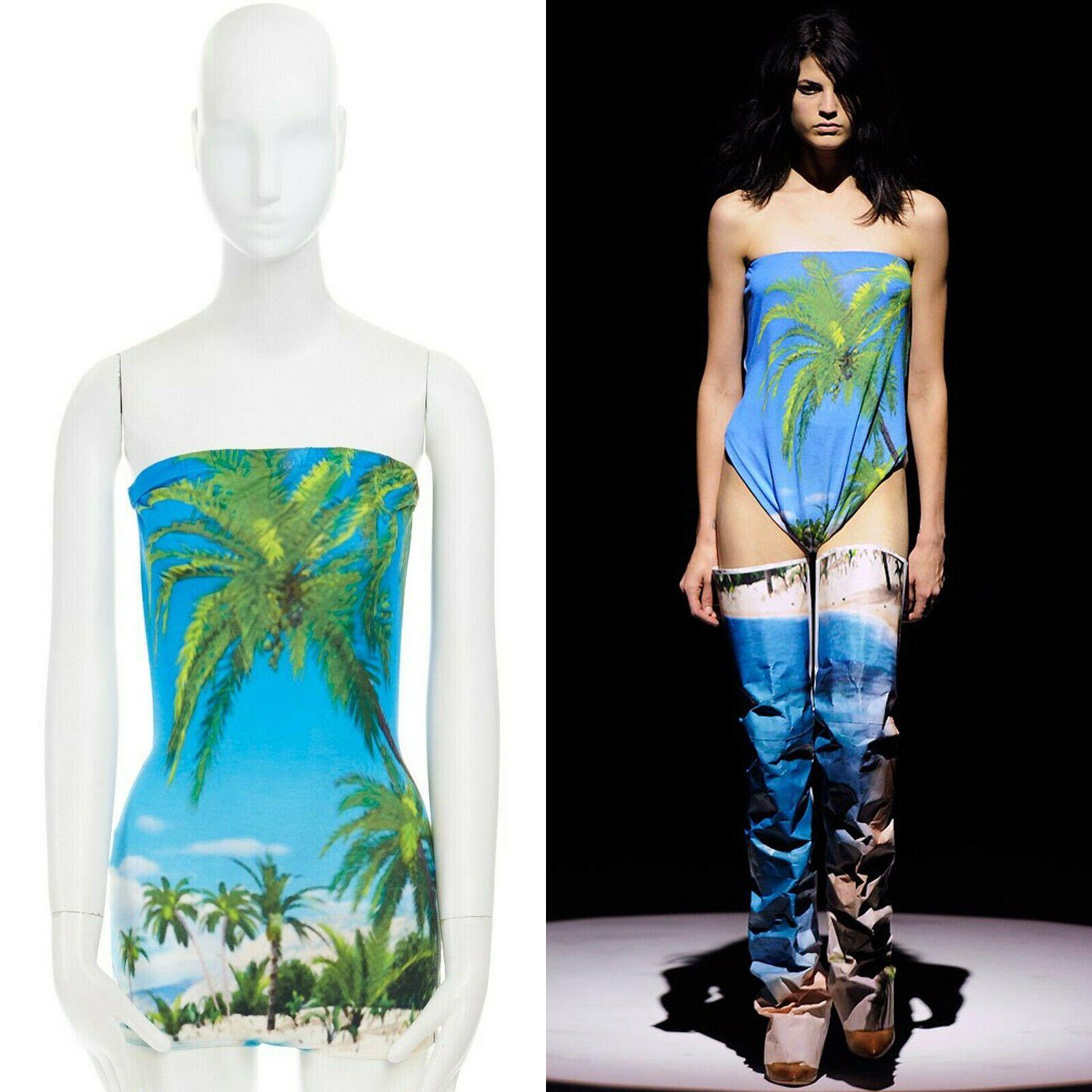 runway MARTIN MARGIELA SS10 tropical palm print backless bodysuit romper IT38 XS

MAISON MARTIN MARGIELA
FROM THE SPRING SUMMER 2010 RUNWAY
White rayon. Blue ad green tropical palm tree scenic print at front. Strapless top. Bodysuit romper. 
Open