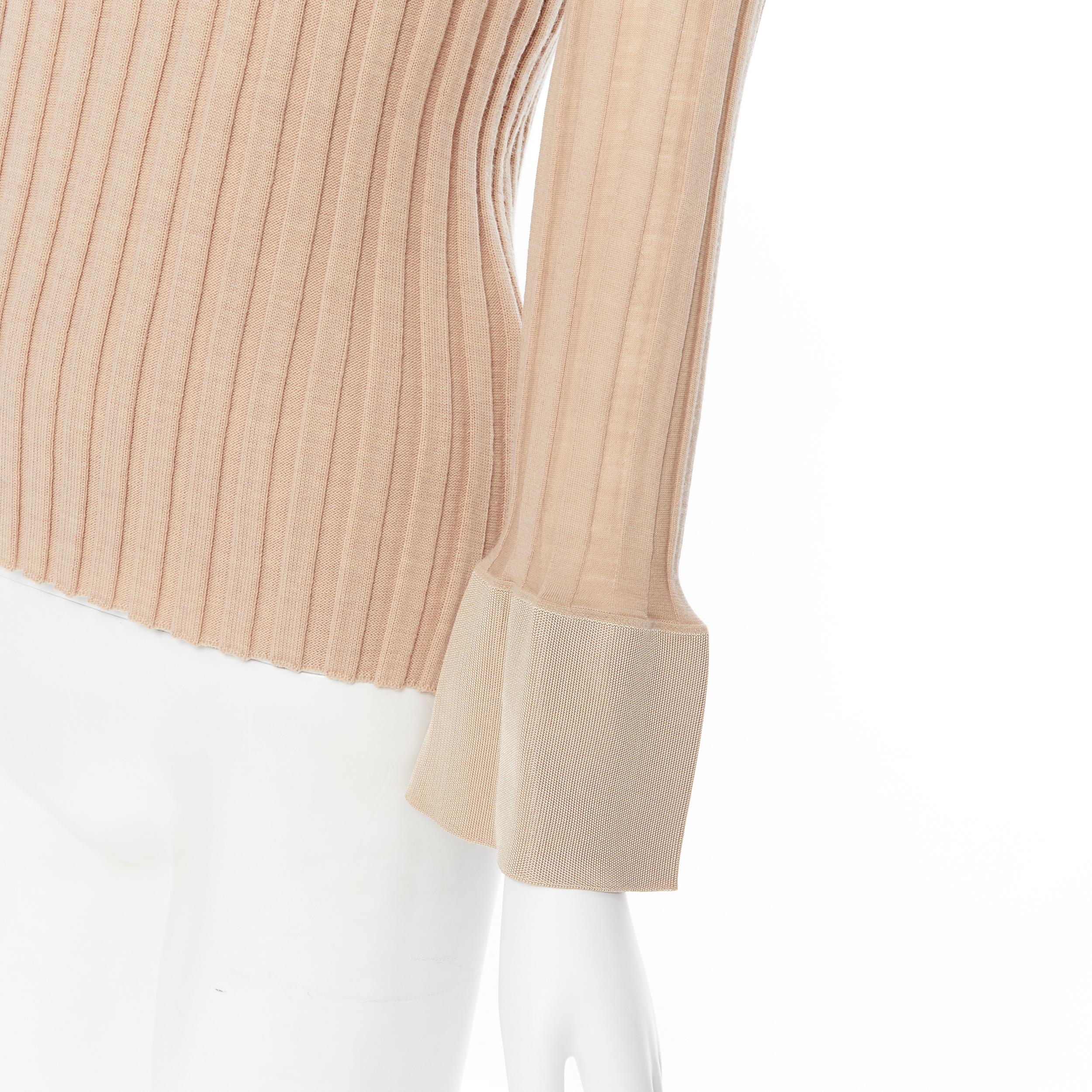 runway OLD CELINE Phoebe Philo beige ribbed knit flared bell cuff sweater top XS 
Reference: SNKO/A00087 
Brand: Celine 
Designer: Phoebe Philo 
Material: Wool 
Color: Beige 
Pattern: Solid 
Extra Detail: Ribbed knit. Contract collar and flared