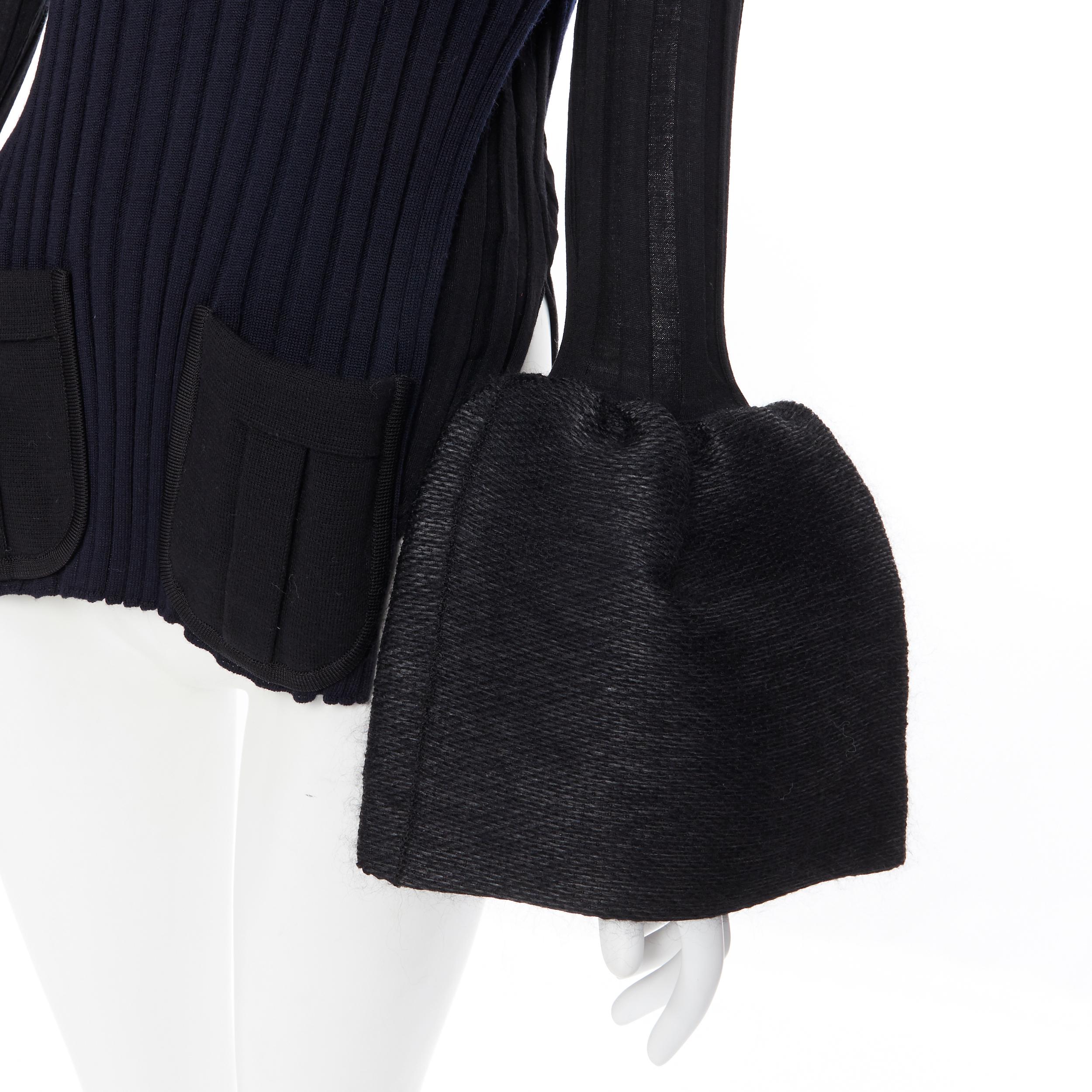 runway OLD CELINE PHOEBE PHILO black ribbed knit dual pocket flared cuff top XS
Brand: Celine
Designer: Phoebe Philo
Model Name / Style: Flared cuff sweater
Material: Wool blend
Color: Black, navy
Pattern: Solid
Extra Detail: Iconic top. Navy and