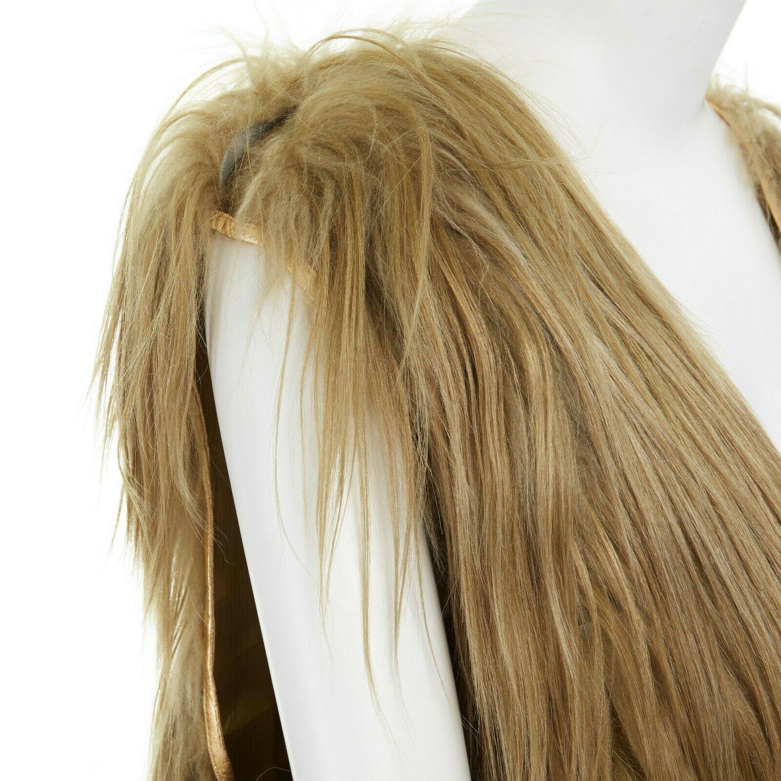 runway PRADA gold genuine long goat fur leather trimmed V-neck shift dress IT38

PRADA
Genuine long goat fur. Gold with green tint. 
V-neck. Gold leather trimming along neckline and sleeves. 
Sleeveless. Oversized boxy fit. Fully lined in silk.