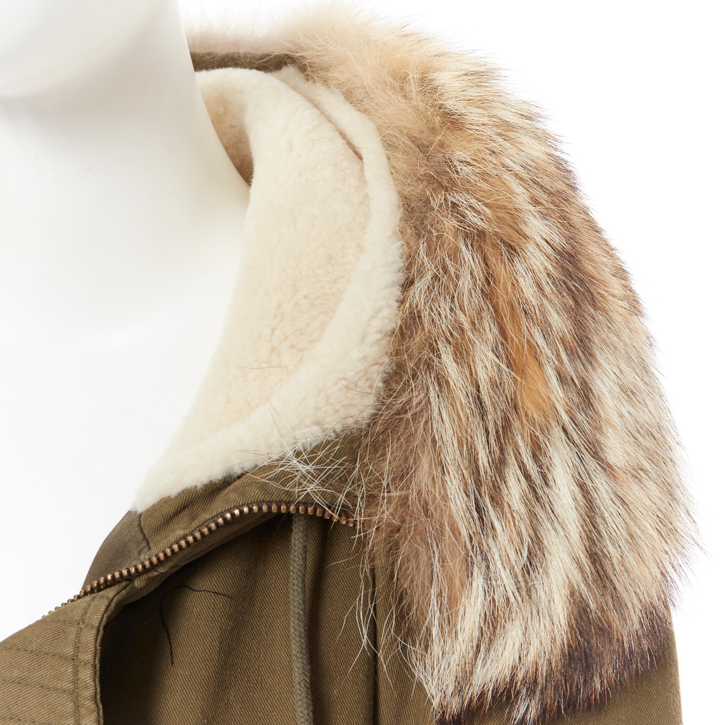 runway SAINT LAURENT AW14 coyote fur trimmed shearling hooded parka FR36
Brand: Saint Laurent
Designer: Hedi Slimane
Collection: Fall Winter 2014
Model Name / Style: Parka coat
Material: Cotton blend
Color: Green
Pattern: Solid
Closure: