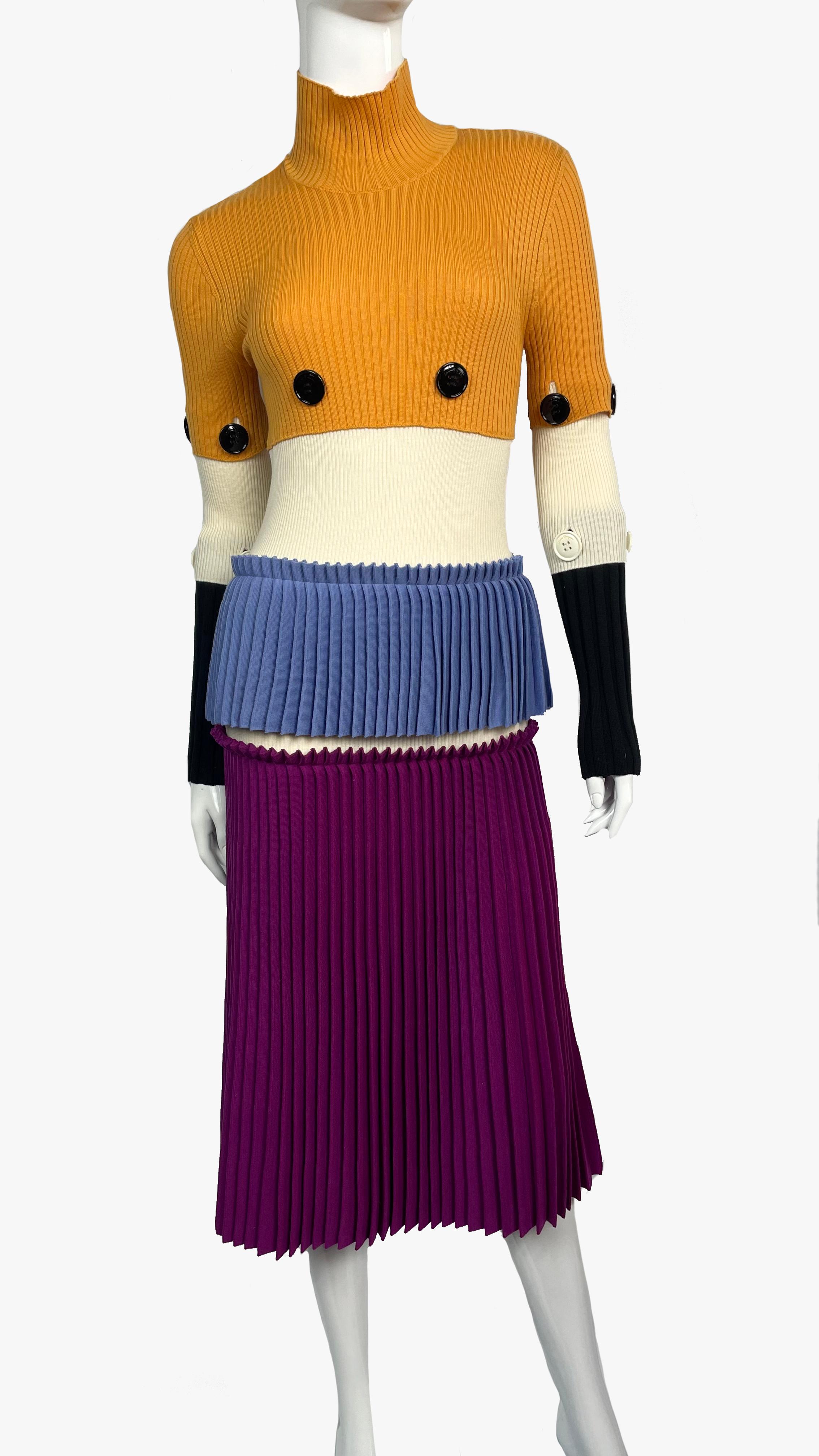Runway Salvatore Ferragamo tiered pleated dress with yellow, blue, white and purple layers. Accented with black and white buttons. 
Fall-Winter Ready-to-Wear Collection 2016. 
Sleeves are fastened with buttons
Size: S
Composition: 100% virgin wool
