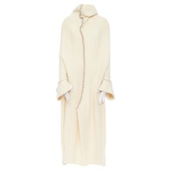 runway YOHJI YAMAMOTO cream wool  whipstitch high collar open back sweater dress
