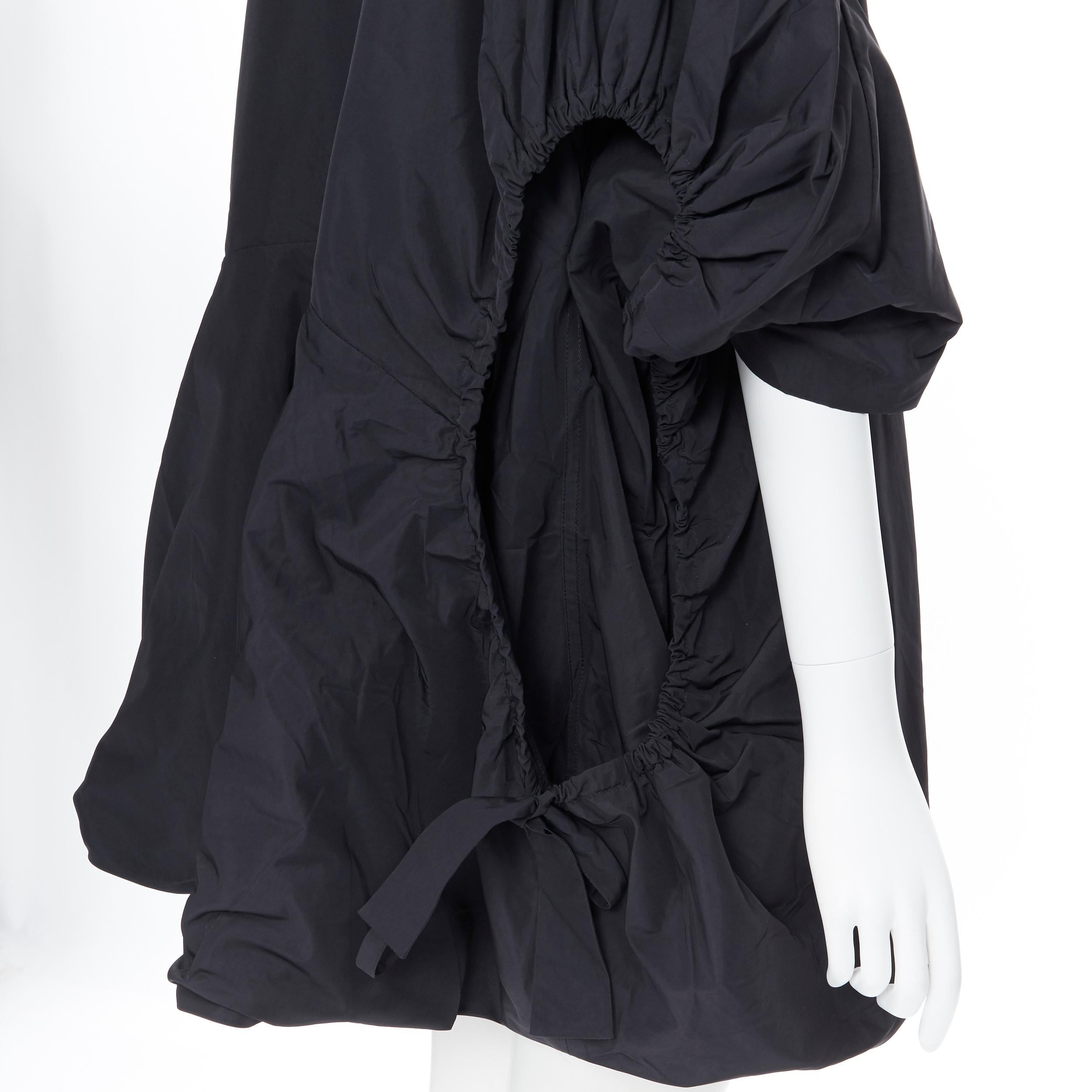 runway YVES SAINT LAURENT 2009 black nylon cut out drawstring cocoon coat FR38 S Reference: CEWG/A00006 
Brand: Yves Saint Laurent 
Designer: Stefano Pilati 
Collection: Spring Summer 2019 Runway 
Material: Polyester 
Color: Black 
Pattern: Solid