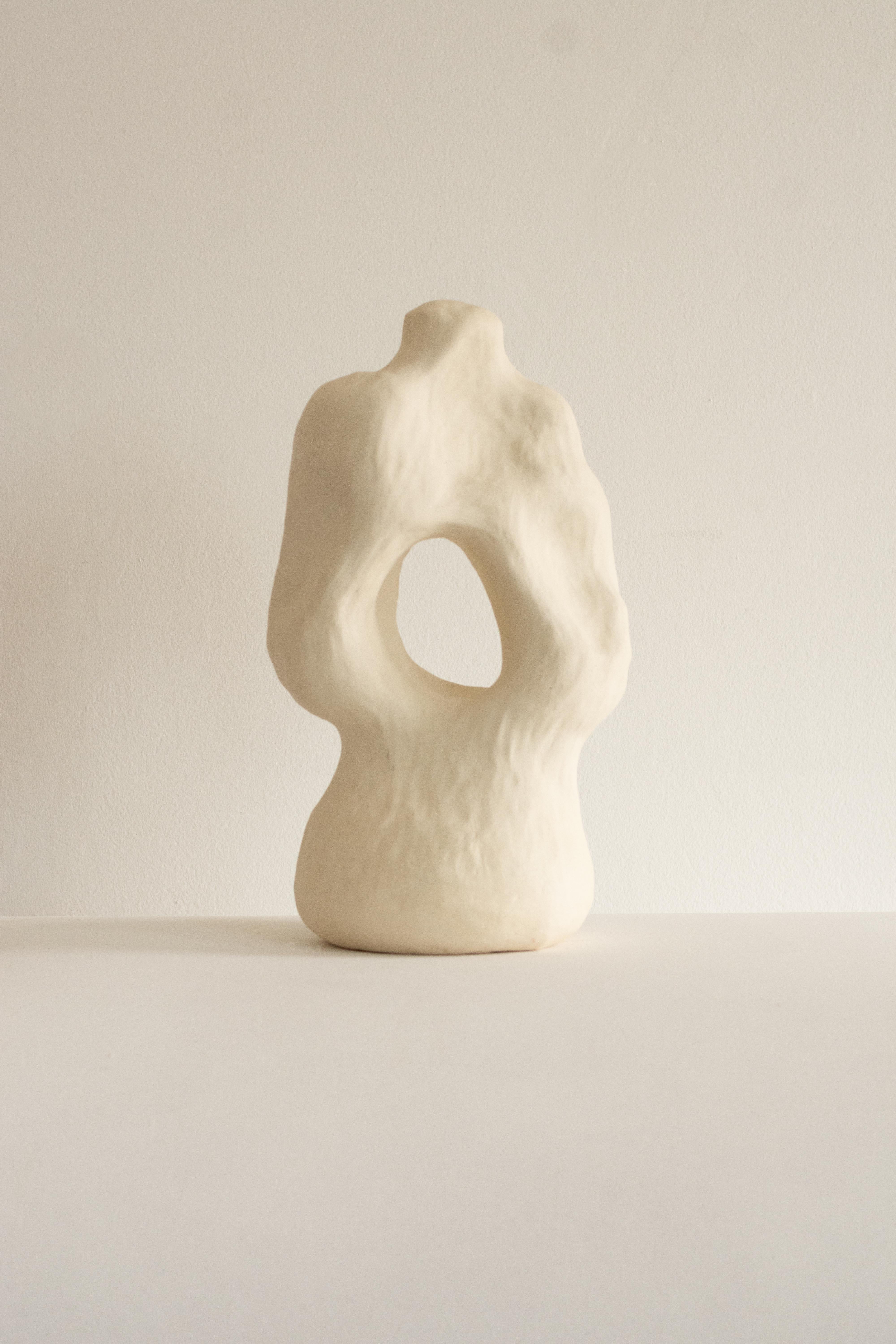 This sculpture is part of the Rupa series, a collection of handcrafted pieces crafted without molds that absorb the contours and textures of the craftsman's hand, transforming it into an object with a clean and complex shape.

The sculpture N.6