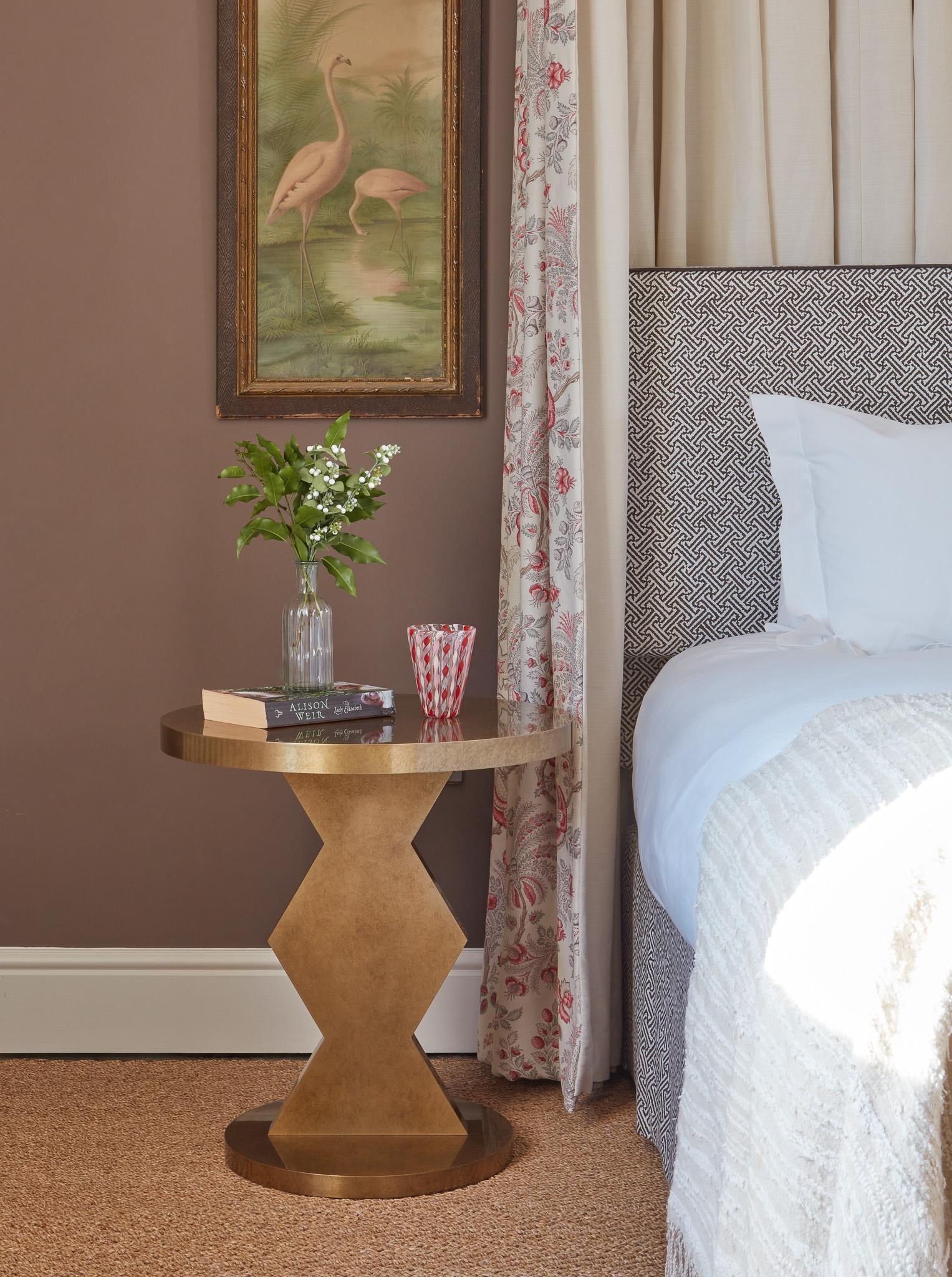 This traditionally constructed side table is available with oak and a brass sheet finish.