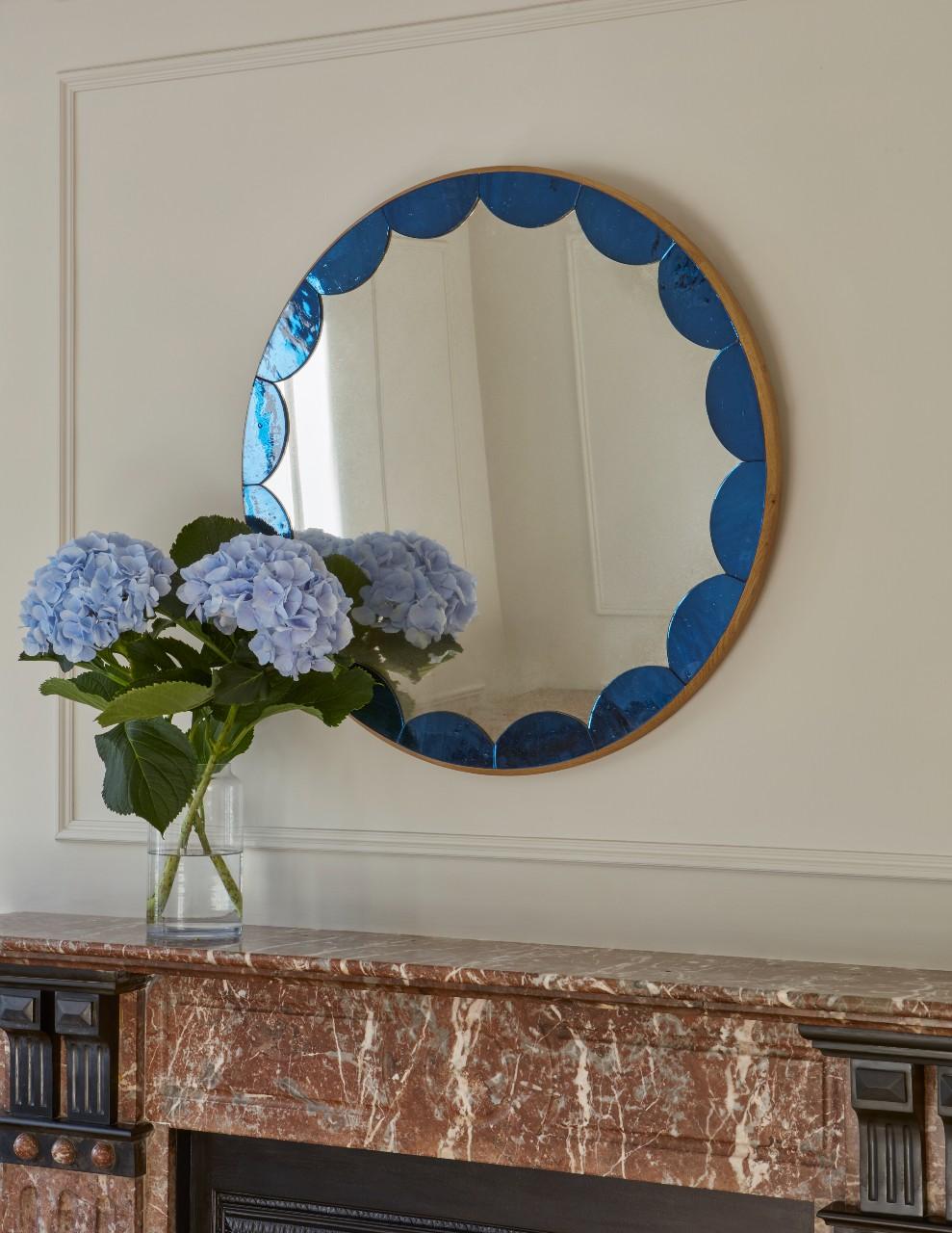 Each mirror is made of cathedral glass scallops carefully placed on a fumed oak frame, surrounding an antiqued mirror glass centre.

Handcrafted in our Shropshire Workshops, each mirror is made with hidden split batten wall fixings.

Available in