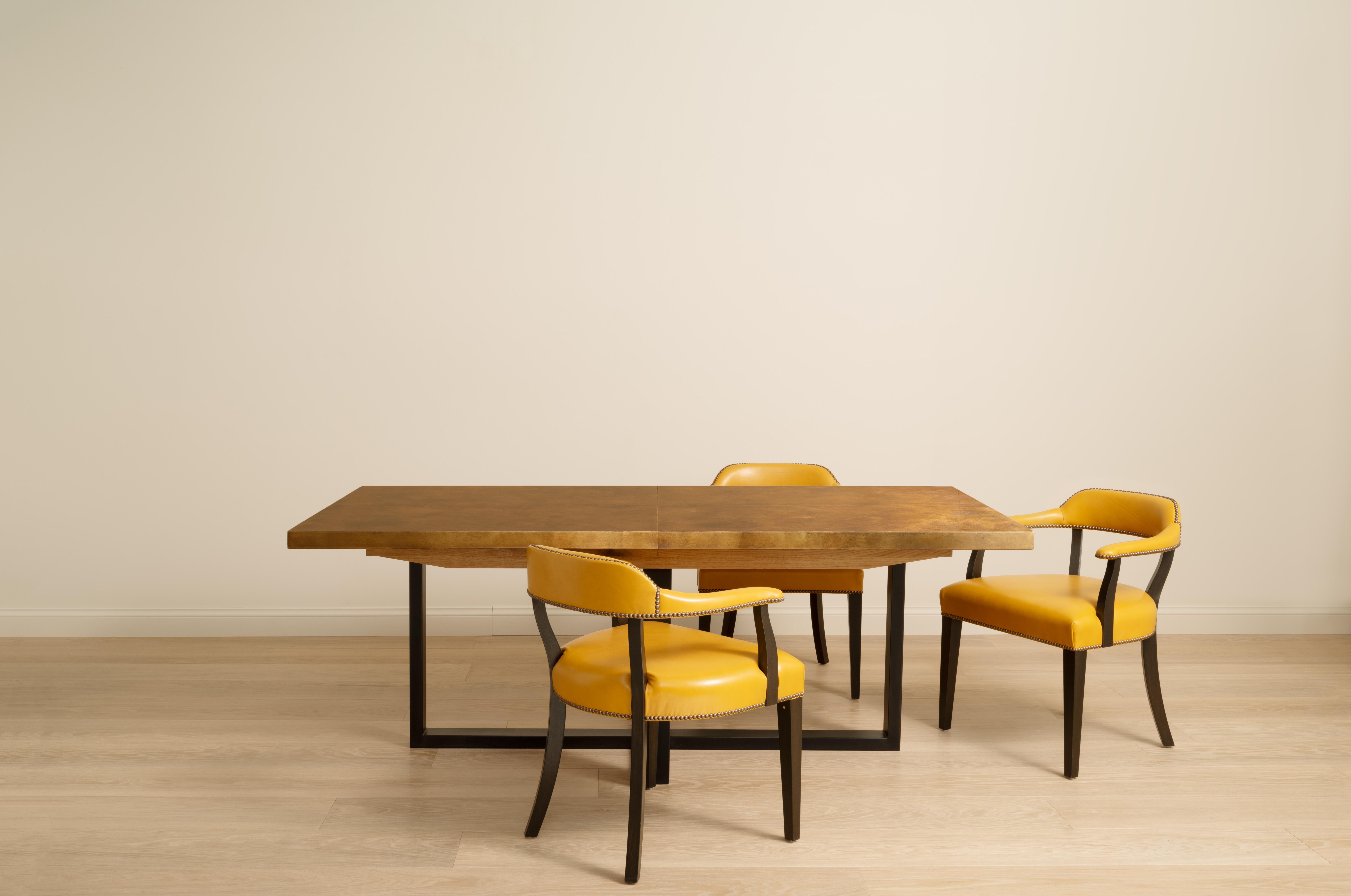 The Denver Dining table is our patinated brass wrapped top and steel base extendable table. With the inclusion of two table leaves, this impressive dining table can seat up to 10 people comfortably when extended. Also available in Copper and