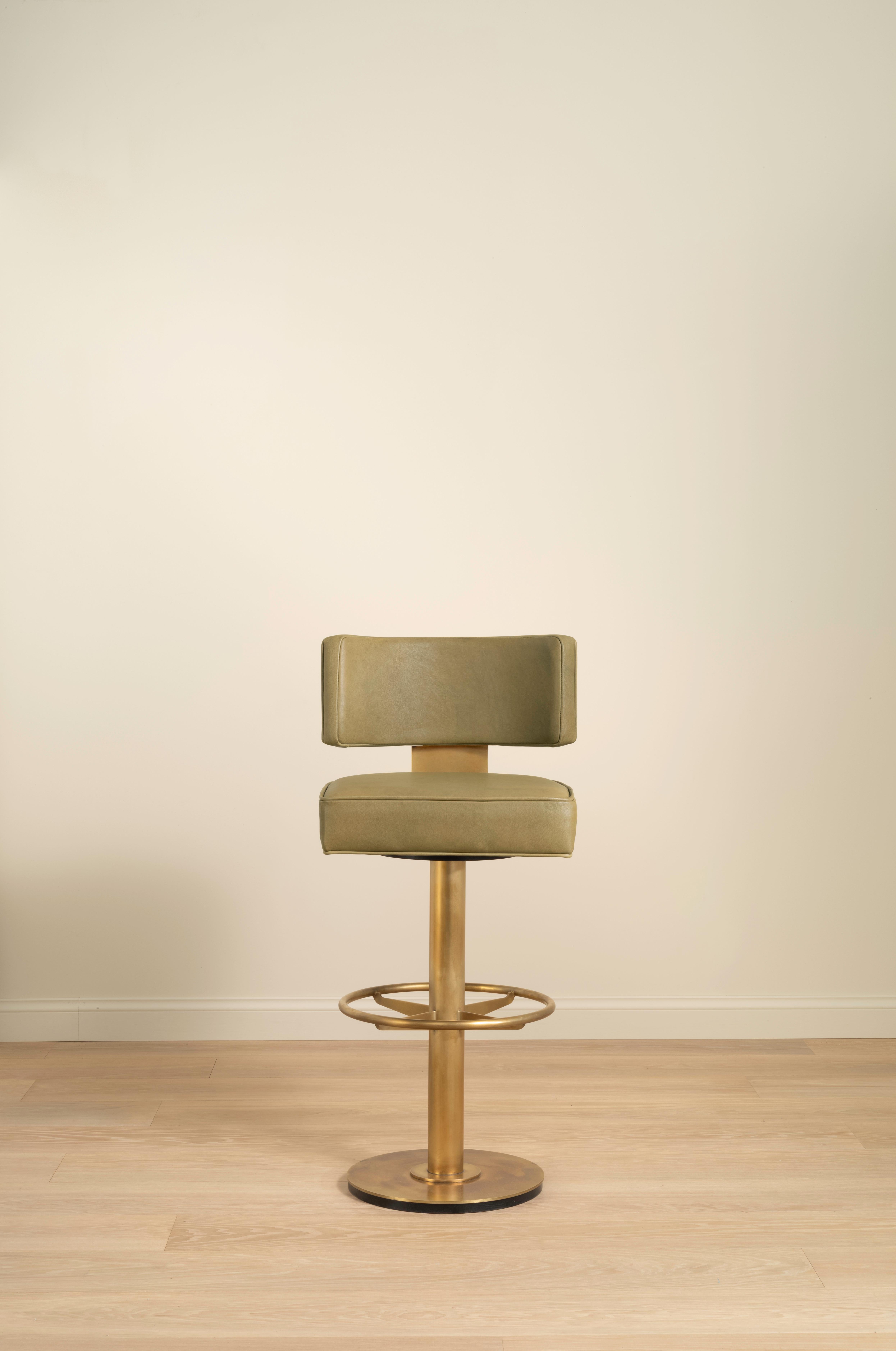 The Lafon barstool reworks the original design for the bar setting. Crafted with a patinated brass finish pedestal and backsplat, and generous upholstered seat, complete with a bespoke swivel mechanism. Upholstered in clients’ own fabric and/or