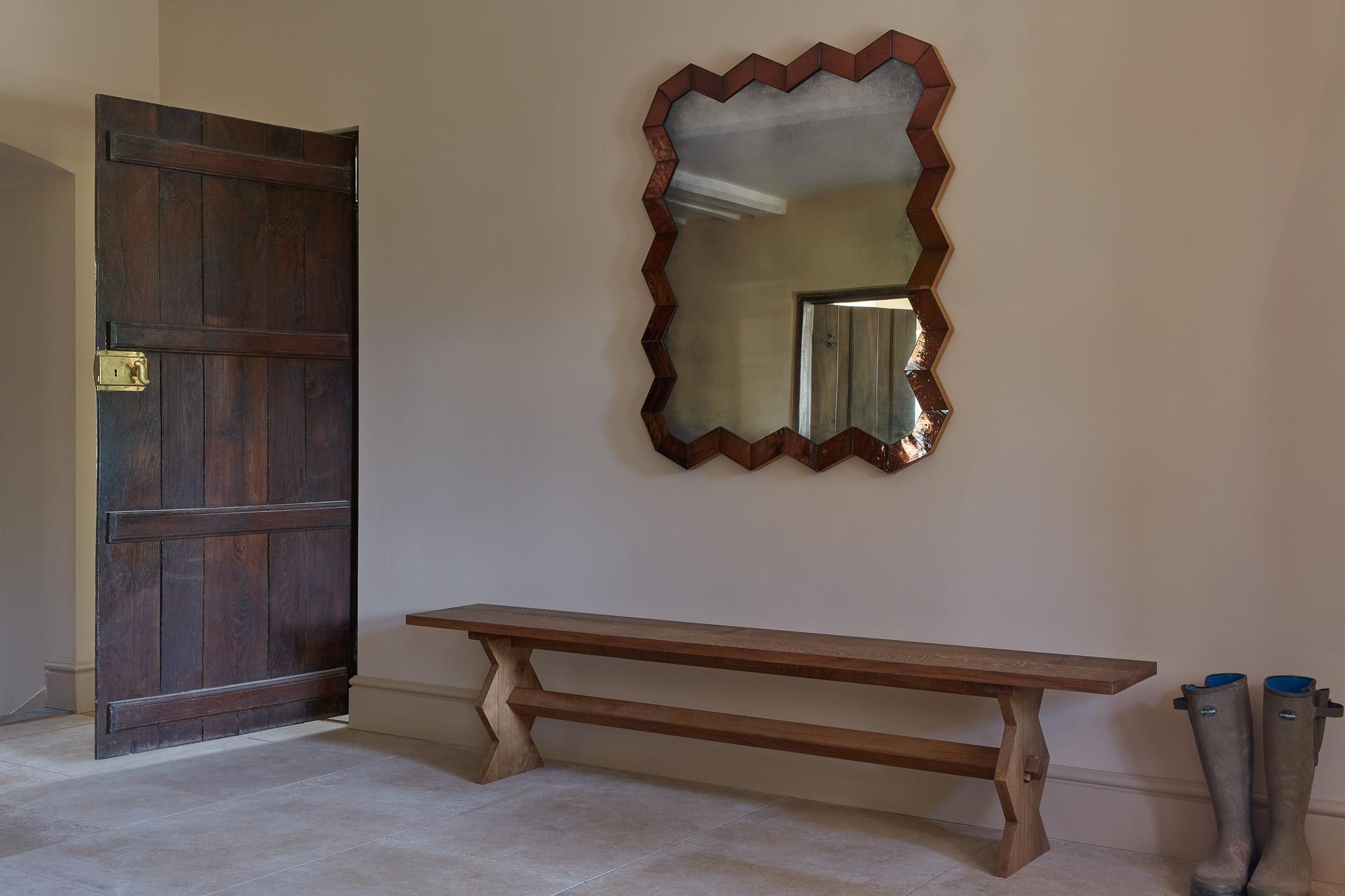 A contemporary bench with geometrically shaped legs inspired by the designer Marcel Coard.

Traditionally constructed in solid oak and available in a natural, medium or dark finish.

Cushion is not included. 