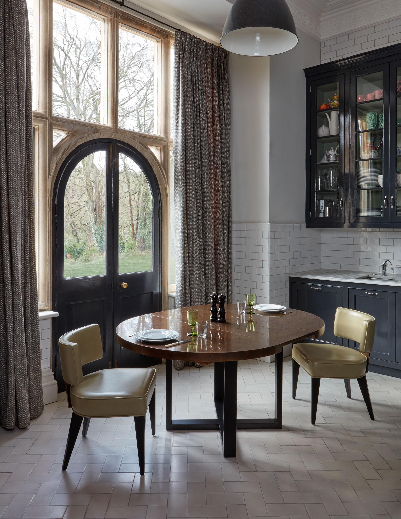 The Orlando Dining Table features a brass, copper or zinc wrapped table top with a 'x' frame steel base, in a powder coated steel finish. 

This table provides comfortable seating for up to eight people.

