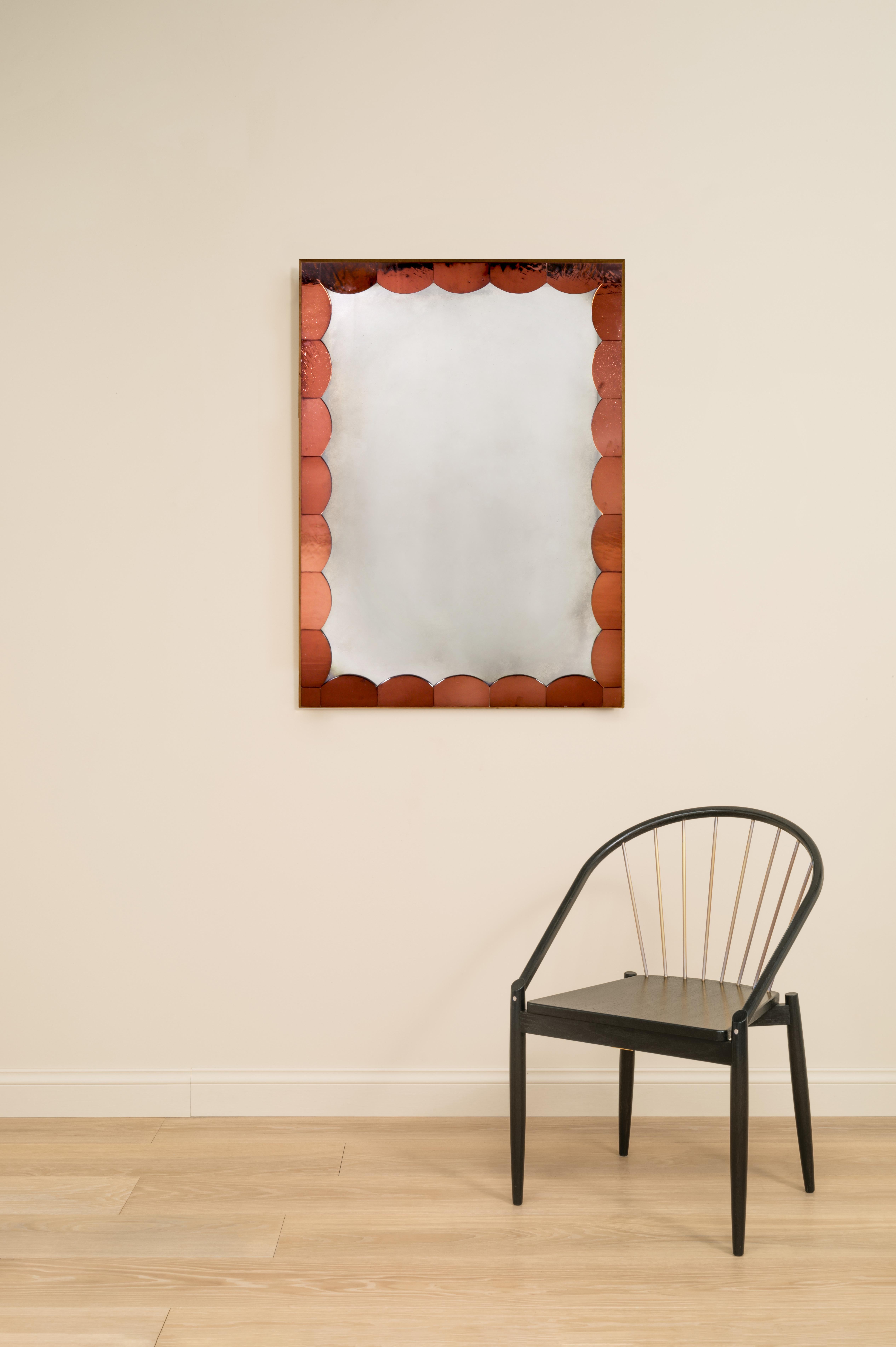 Each mirror is made of cathedral glass scallops carefully placed on a fumed oak frame, surrounding an antiqued mirror glass centre.

Handcrafted in our Shropshire Workshops, each mirror is made with hidden split batten wall fixings.

Available in