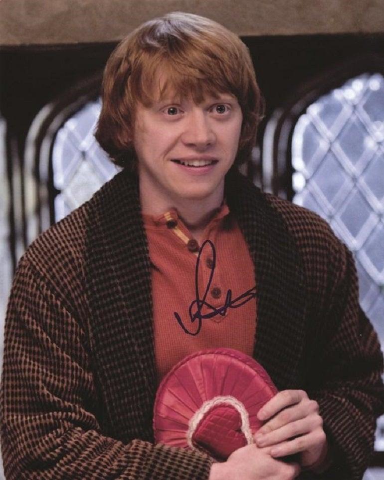 A signed colour photograph of Harry Potter star Rupert Grint

Rupert Grint (1988-) is an English actor who rose to fame as Ron Weasley in the blockbuster Harry Potter series of films. 

An 8 x 10 inch half-length colour photograph of Rupert