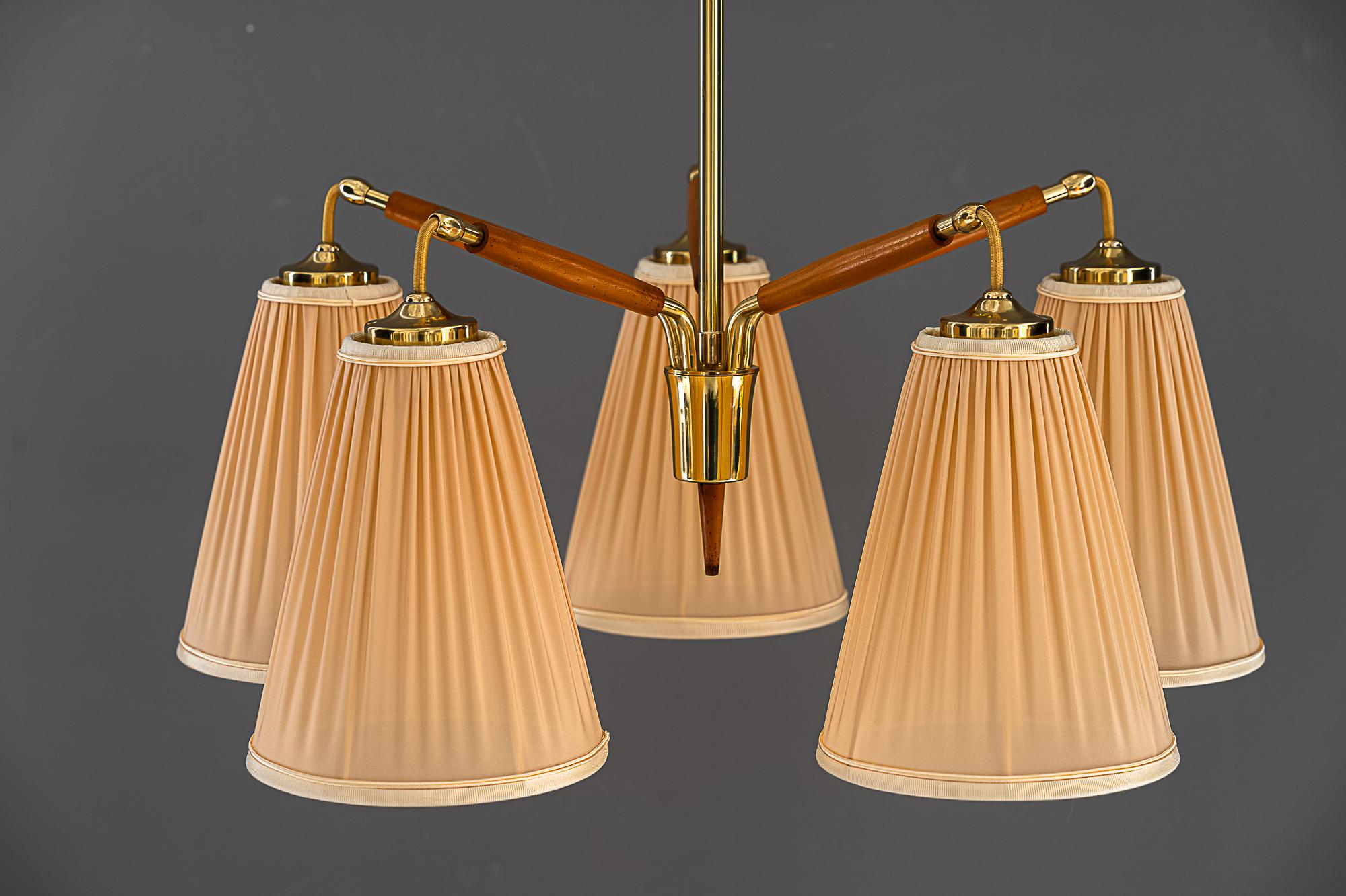Rupert nikoll 5 Arm chandeliers vienna around 1950s
brass and wood 
The shades are replaced ( new )
