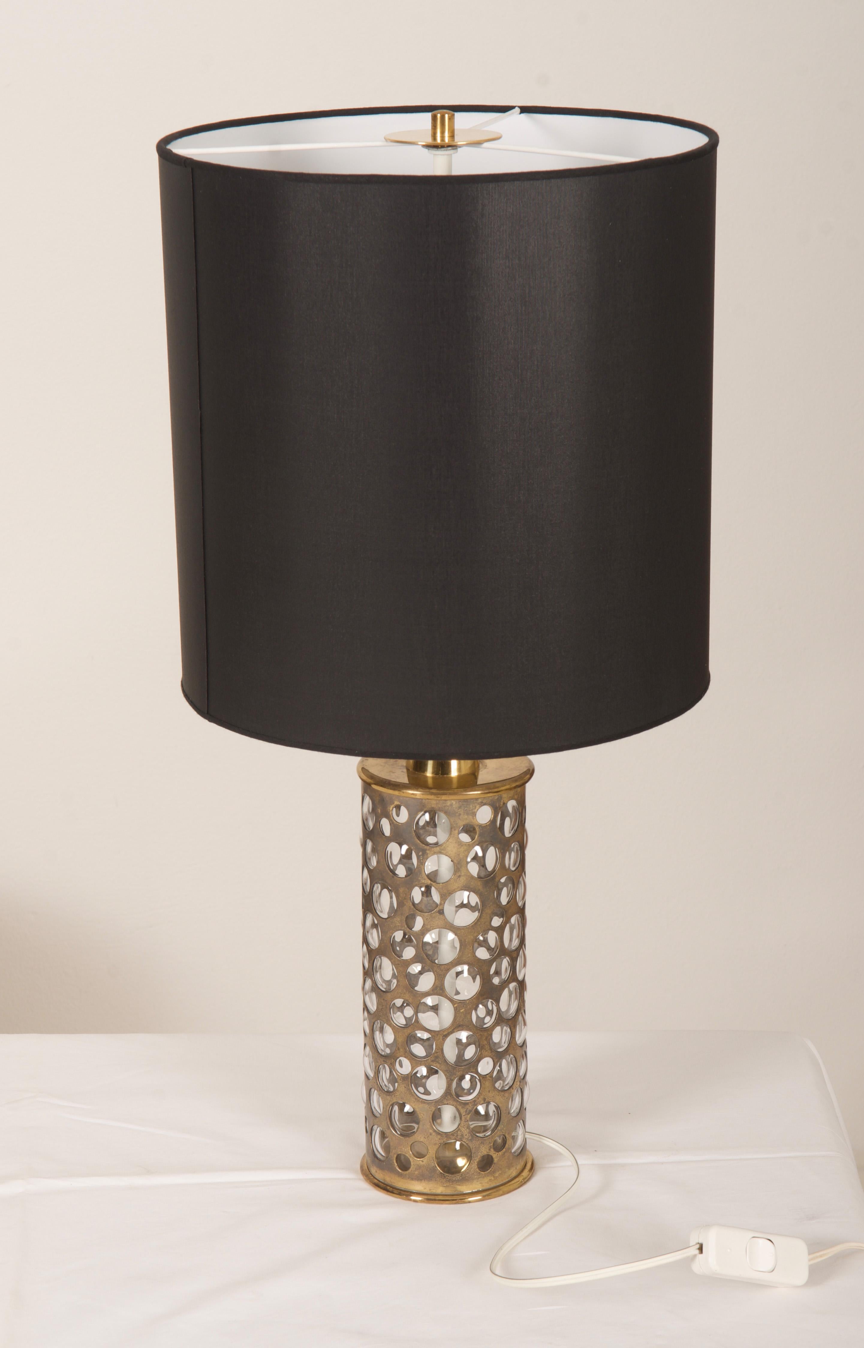 Brass construction with handblowed glass stand and shade fitted with two E27 sockets. 
Made by Rupert Nikoll in the 1960s in Vienna.