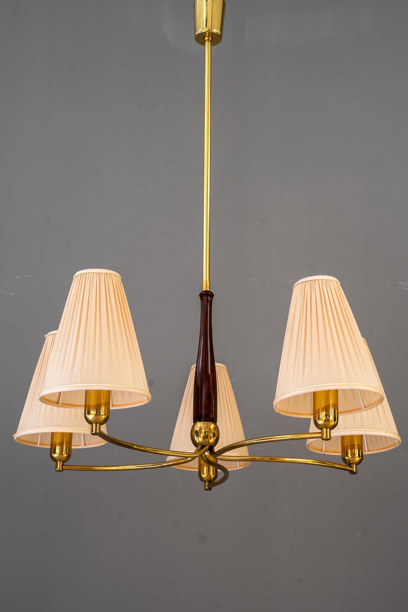 Rupert Nikoll chandelier with fabric shades vienna around 1960s
Brass original condition
The wood is polished
The fabric shades are replaced ( new )