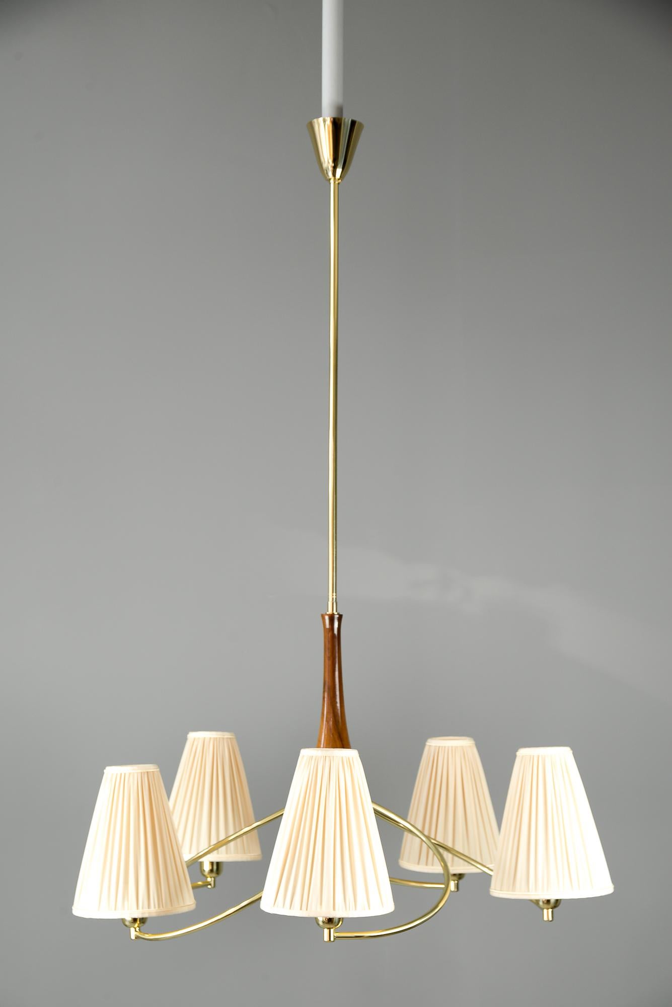 Rupert Nikoll chandelier with nut wood, circa 1950s
Polished and stove enameled
Shades are replaced (new).