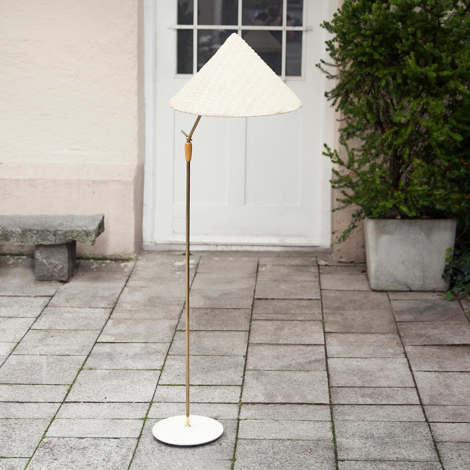 Vintage floor lamp from Kalmar Austria with adjustable stand and flexible bast cord shade.