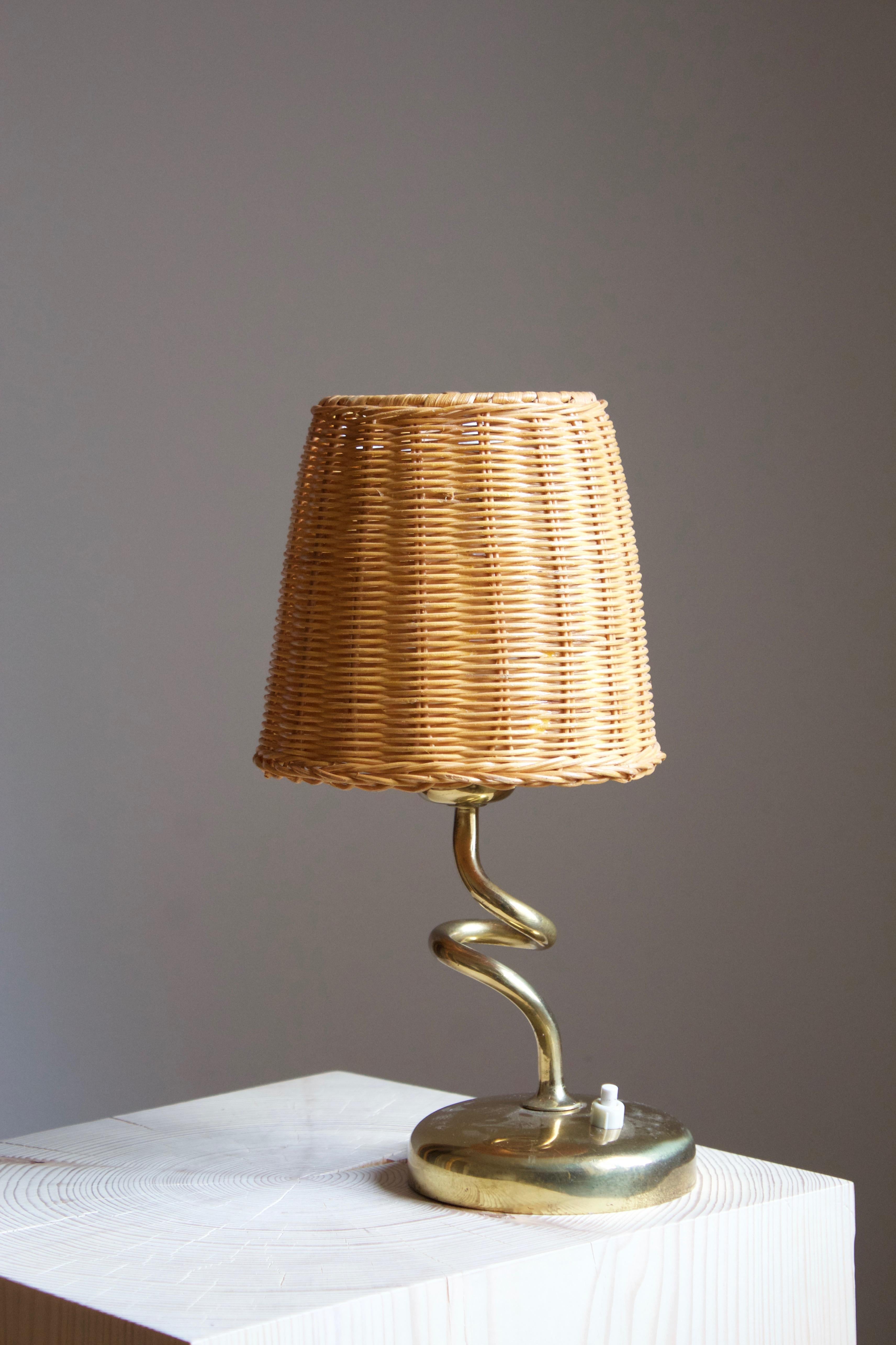 A table lamp, designed and produced by Rupert Nikoll, Austria, 1950s.

Features an assorted vintage rattan lampshade. Stated dimensions include lampshade.

Other designers of the period include Carl Auböck, Josef Frank, Paavo Tynell, Serge