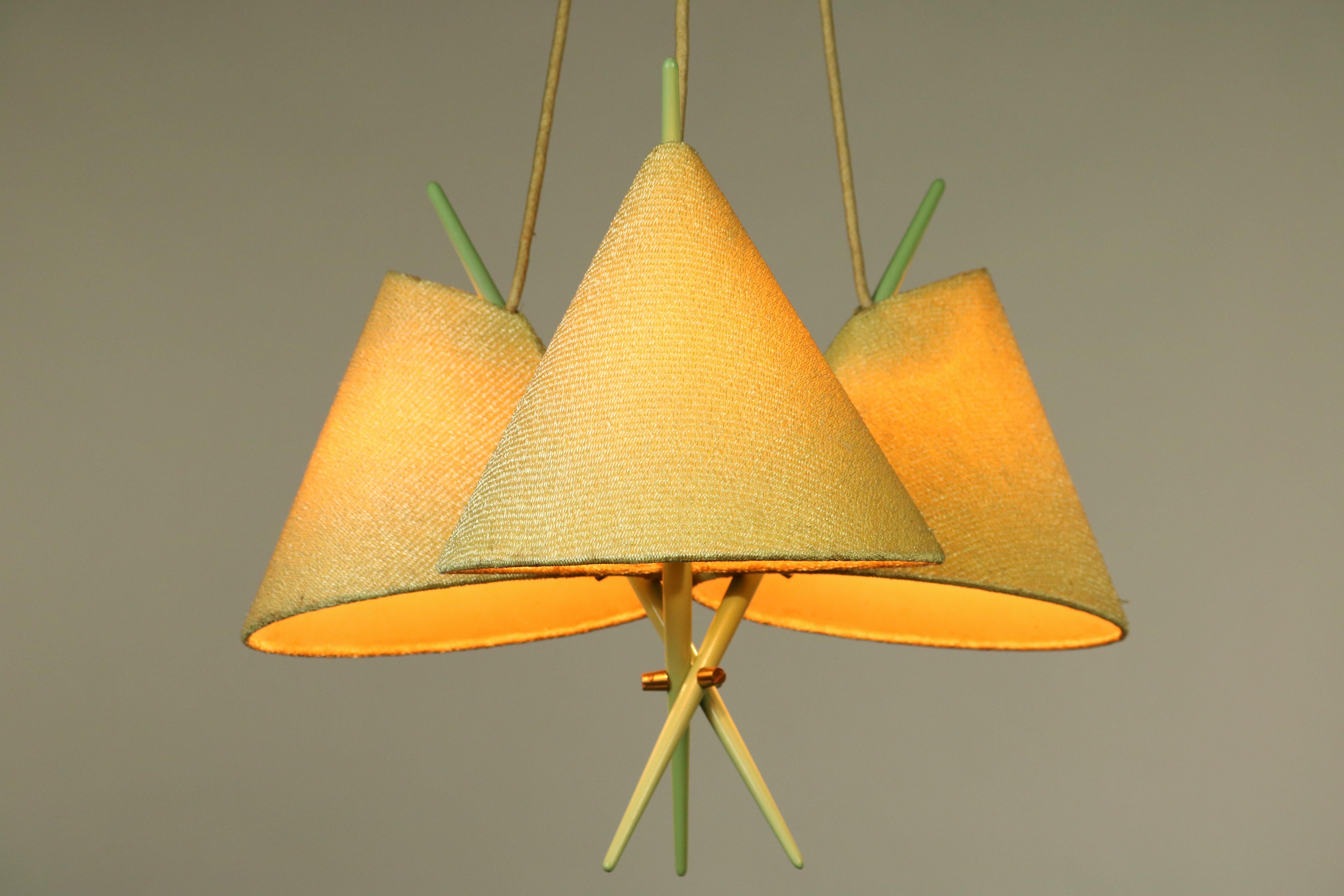 Rare 1950s Rupert Nikoll pendant lamp
the design is reminiscent of chopsticks (pastel green wood) with Chinese hat-lampshades,
as was fashionable in Europe 1950s.

with E14 sockets the small Edison screw
Measures: Weight 800 gr / 1.8