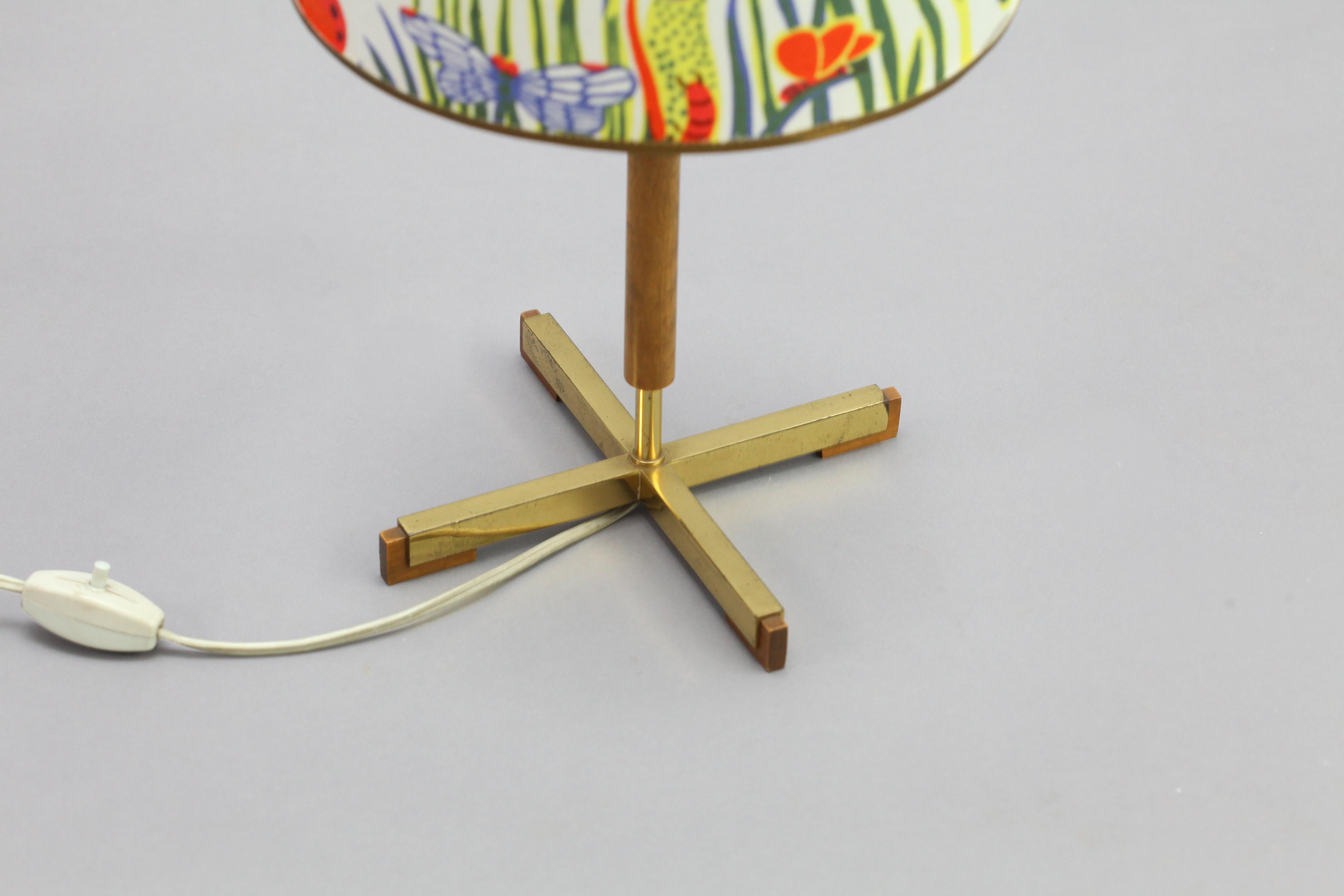 Table lamp,
attributed Rupert Nikoll,
Austria 1950.
Brass/wood base
Leather stam,
New fabric shade.