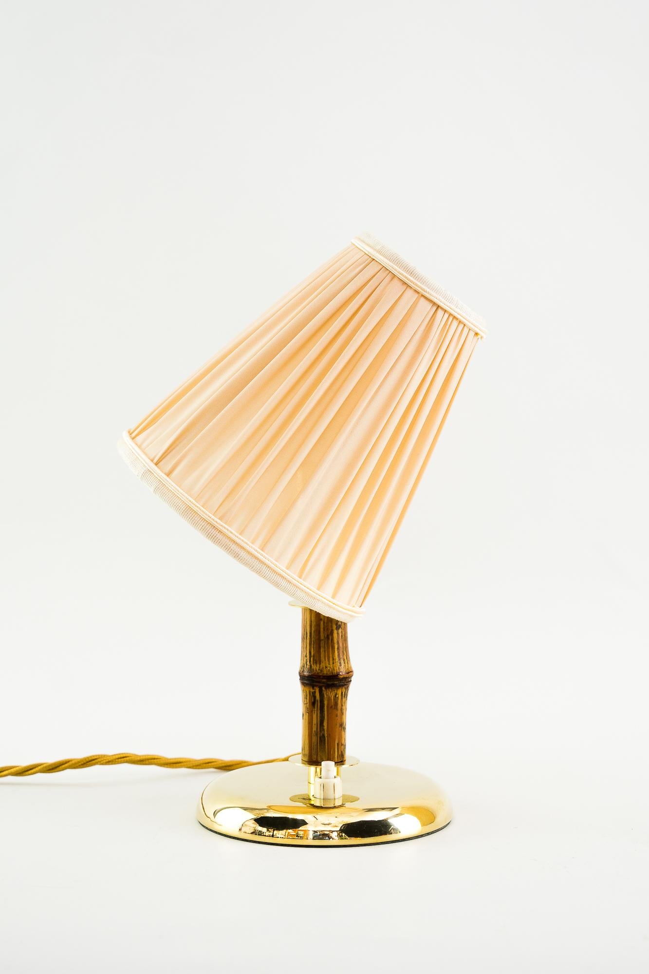Rupert Nikoll table lamp, Vienna, 1950s
Brass polished and stove enameled
Original bamboo.
