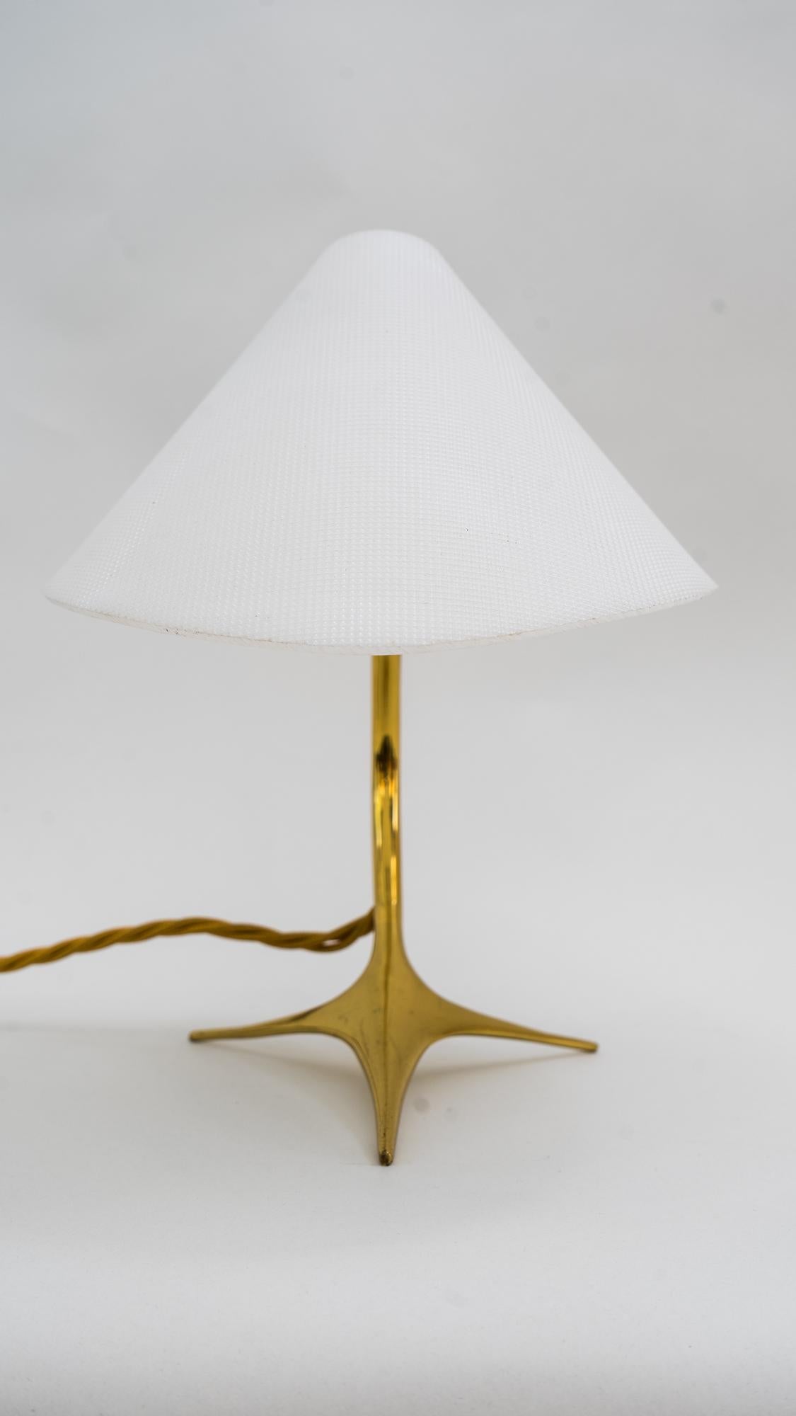 Rupert Nikoll table lamp, Vienna, circa 1950s (the shade is adjustable)
Brass and Lucite
Original condition.