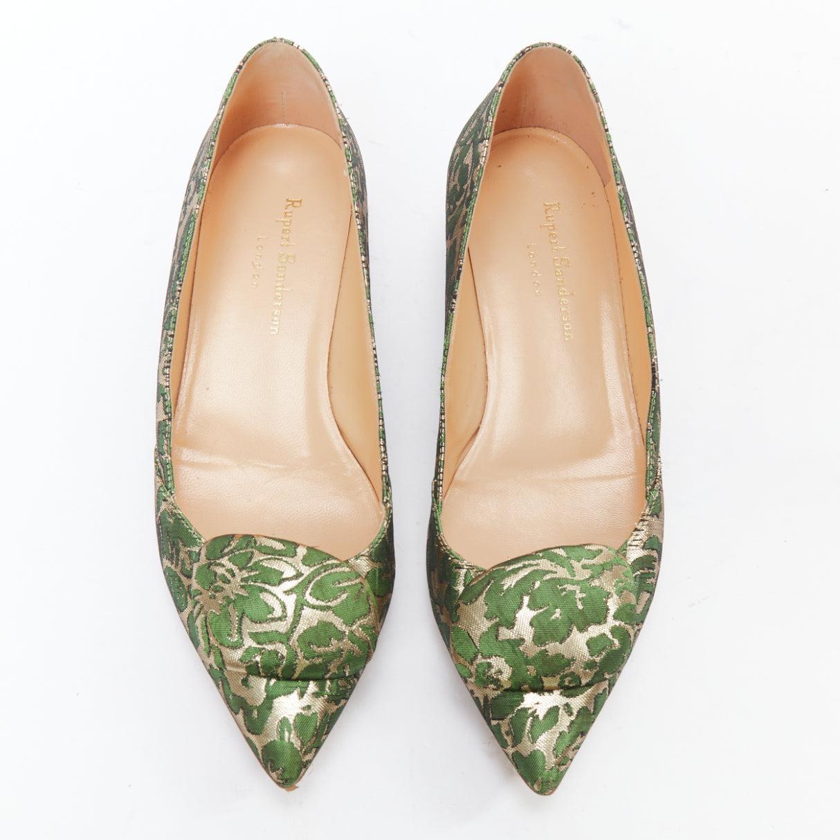 RUPERT SANDERSON Aga green gold brocade embellished pointy flats EU38
Reference: SNKO/A00424
Brand: Rupert Sanderson
Model: Aga
Material: Fabric
Color: Green, Gold
Pattern: Brocade
Closure: Slip On
Lining: Nude Leather
Extra Details: upert