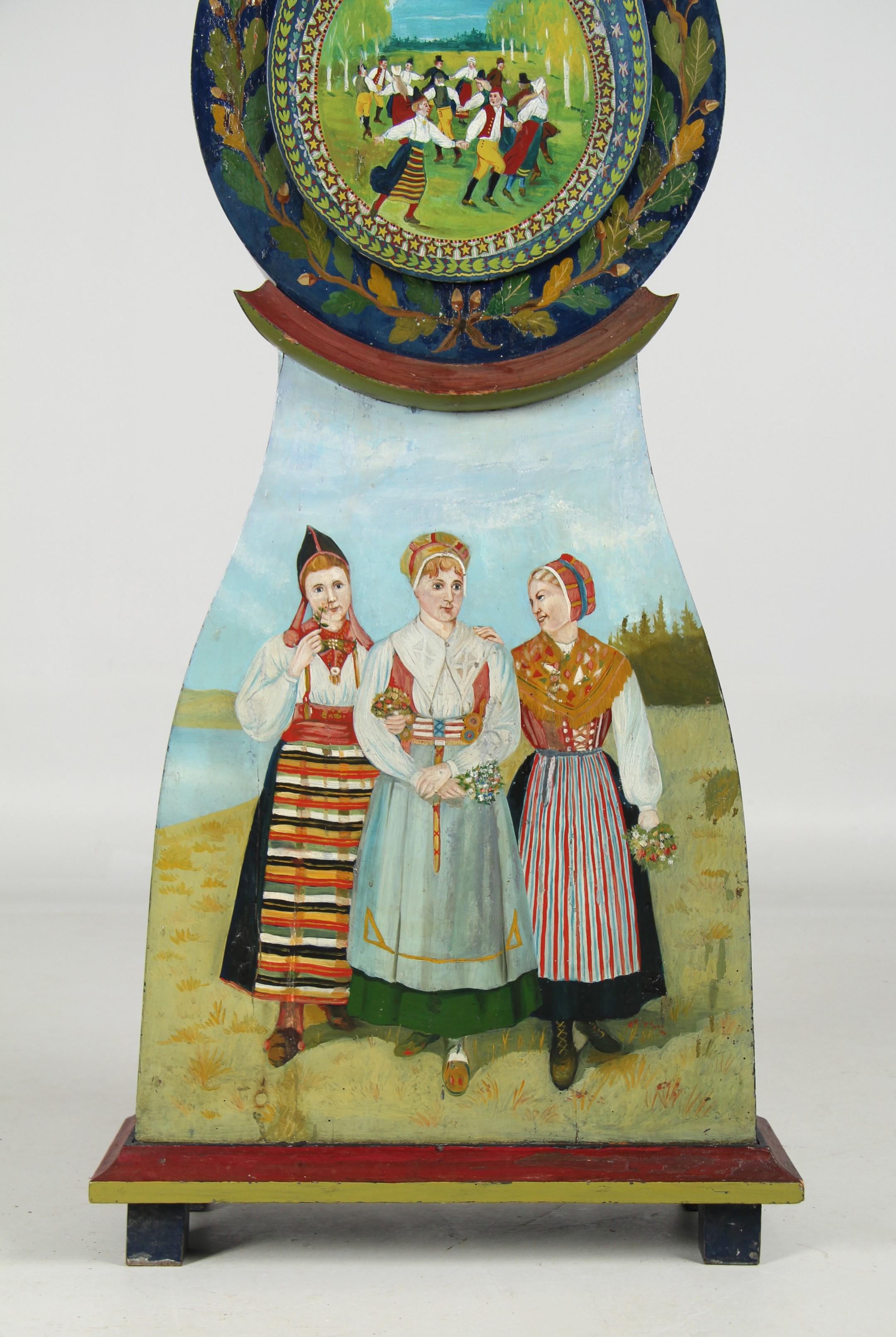 Antique grandfather clock with folklore painting

Sweden
Painted wood
around 1900

Dimensions: H x W x D: 217 x 60 x 22 cm

Description:
Antique grandfather clock in typical Swedish form with an upwardly tapering base, a pear-shaped centrepiece and