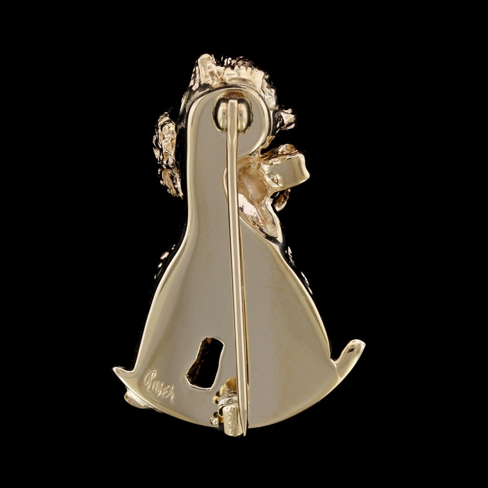Ruser 14K Yellow Gold Poodle Pin. The poodle is set with two round cut sapphire eyes, length 1 1/8
