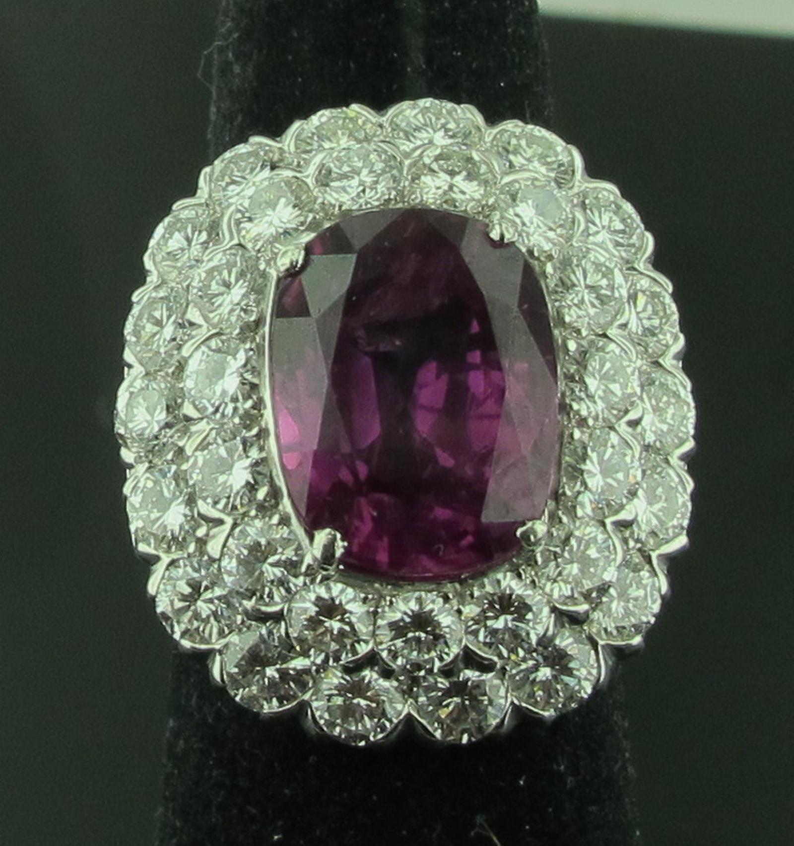 Signed RUSER.  Set in Platinum, in the center is a magnificent 8.39 carat Pink Sapphire surrounded by 43 round brilliant cut diamonds weighing 6.00 carats total. Color is F-G, Clarity is VS.   Pink Sapphire is GIA certified, No Heat.  Ring size 6.