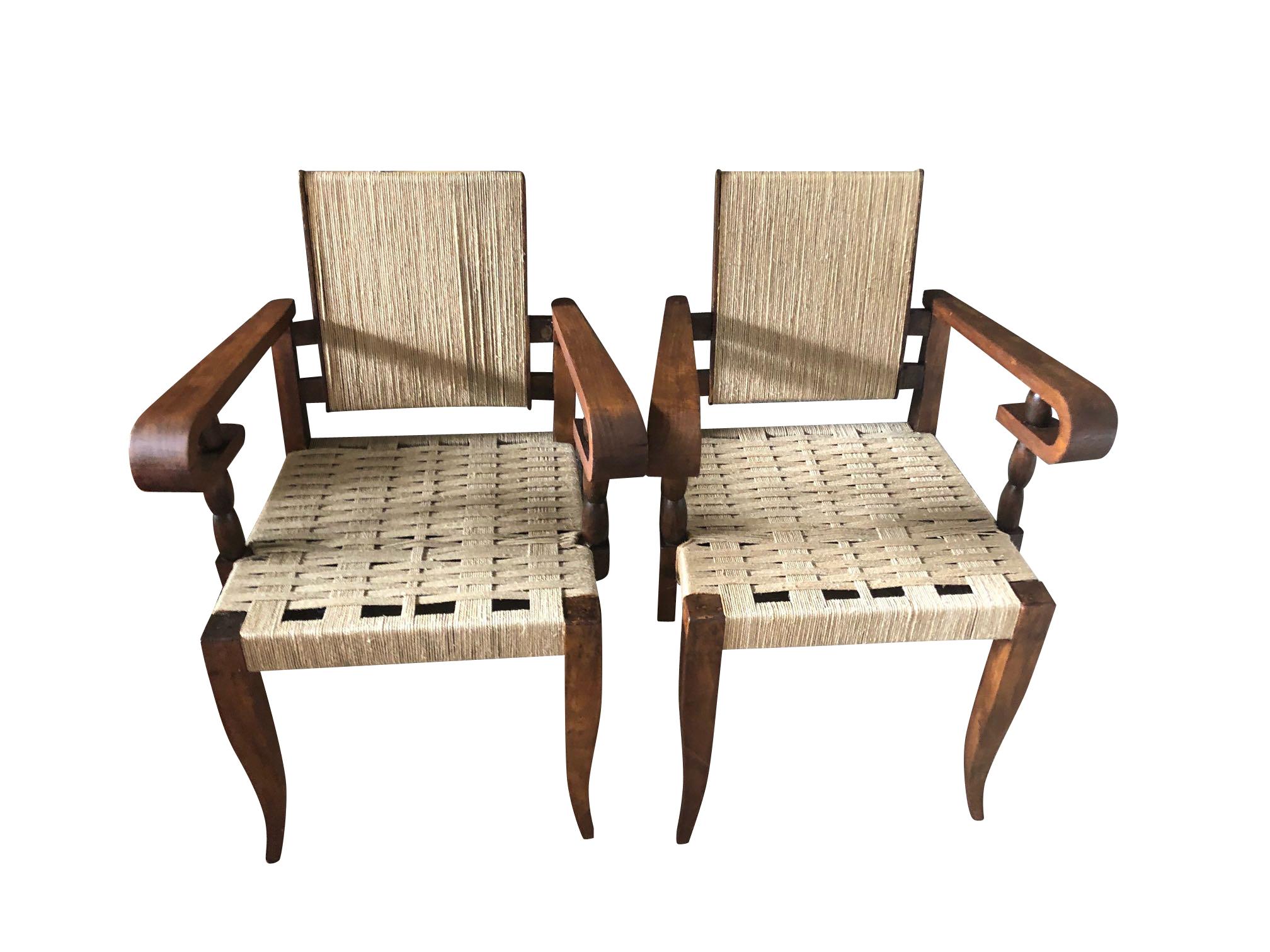 1950s French pair of rush seat and back chairs designed by Victor Coutray.
Decorative curved arm with bobbin details.
Oak wood.
  