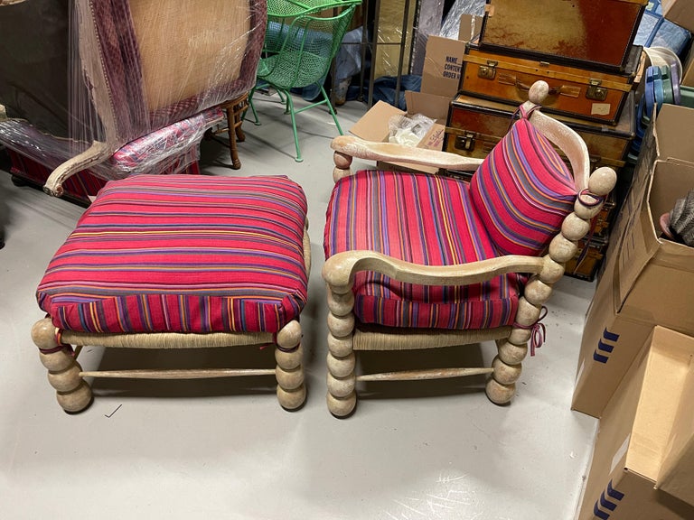 A beautiful rush seat chair and ottoman out of a Palm Springs estate. in the manner of Charles Dudouyt or even Jean Royere, it features upholstered cushions we are including. The rush seats have some sun bleaching as the chair and ottoman was in