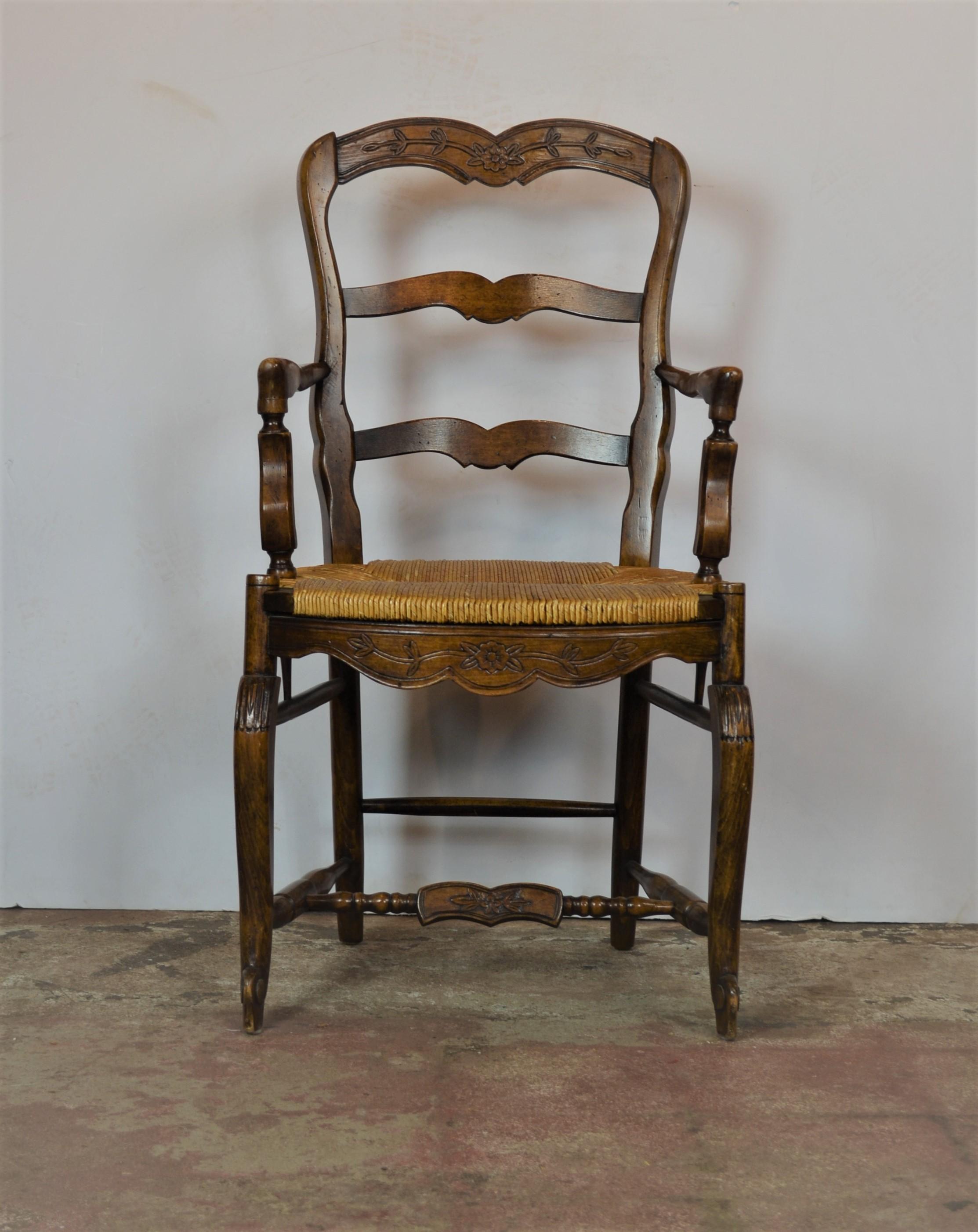 Set of four French Provincial style ladder back rush seat chairs. Pair of arm measures 20