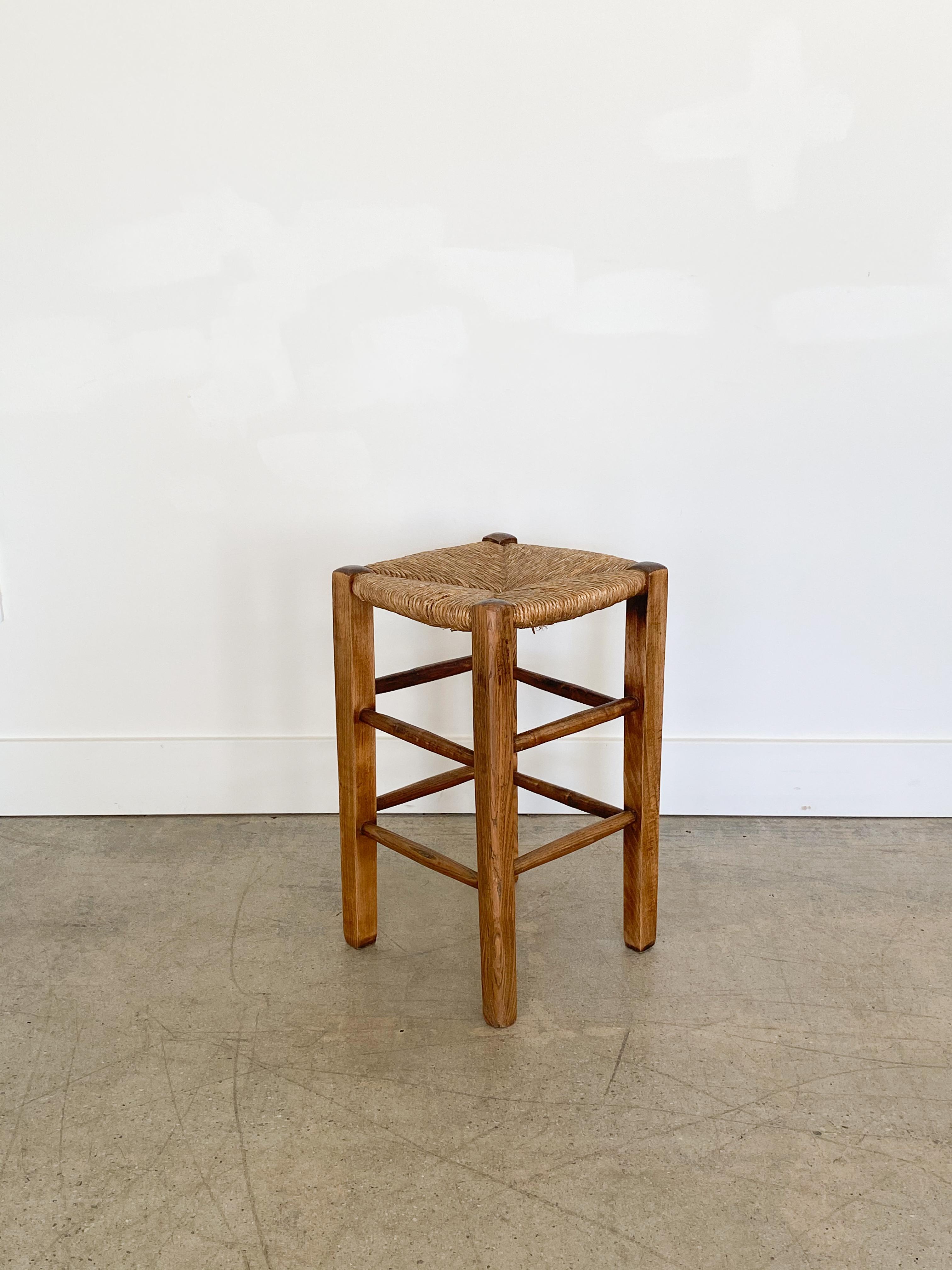 French wood and woven rush stool in the style of Charlotte Perriand.