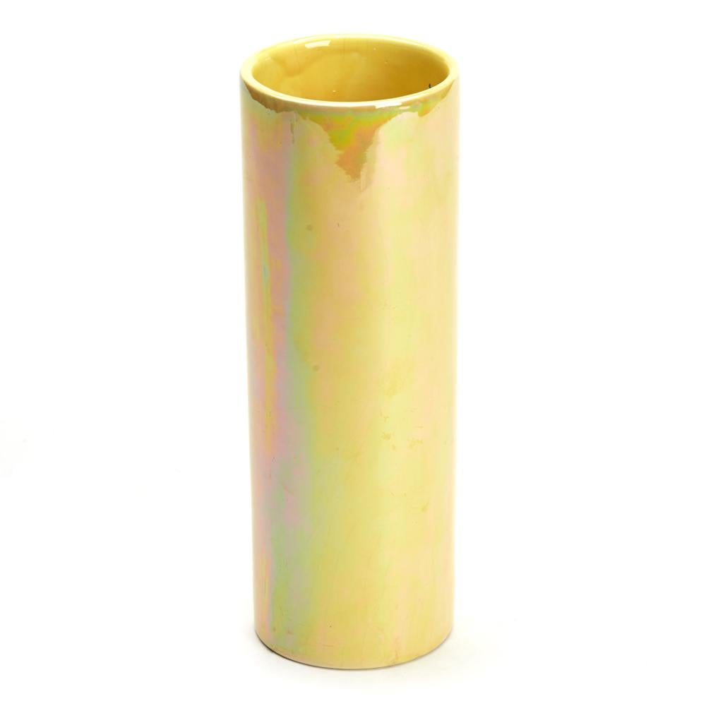 A stunning Arts & Crafts pottery lustre glazed vase attributed to Ruskin and dating from around 1920. The vase is lightly potted and of tall cylindrical shape with an unglazed base the body decorated in bright yellow lustre glazes extending to the